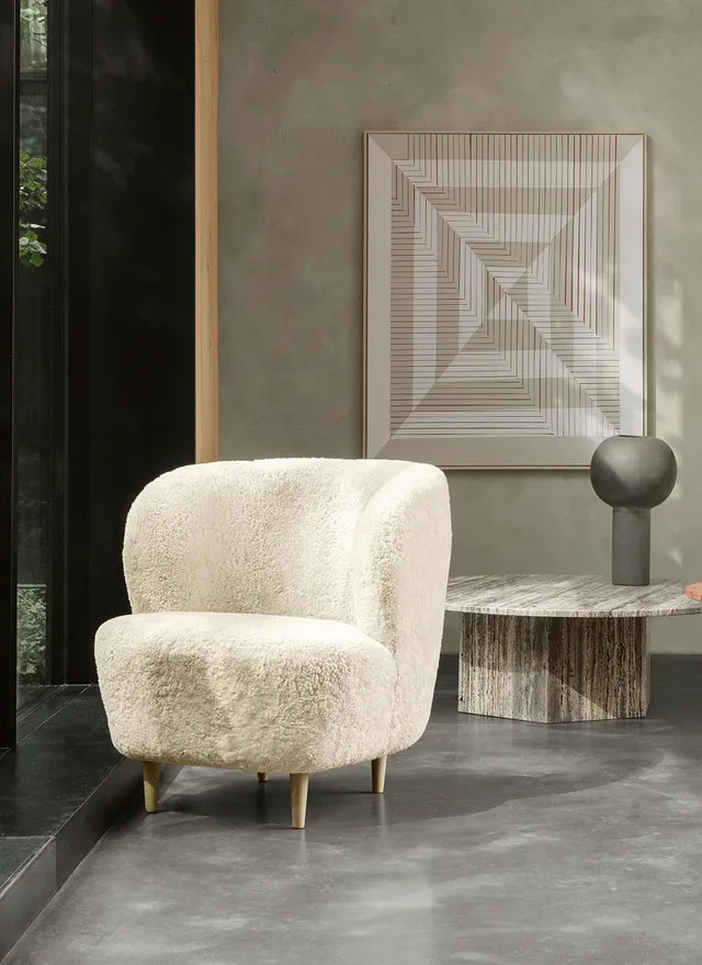 STAY upholstered armchair with a black oak base