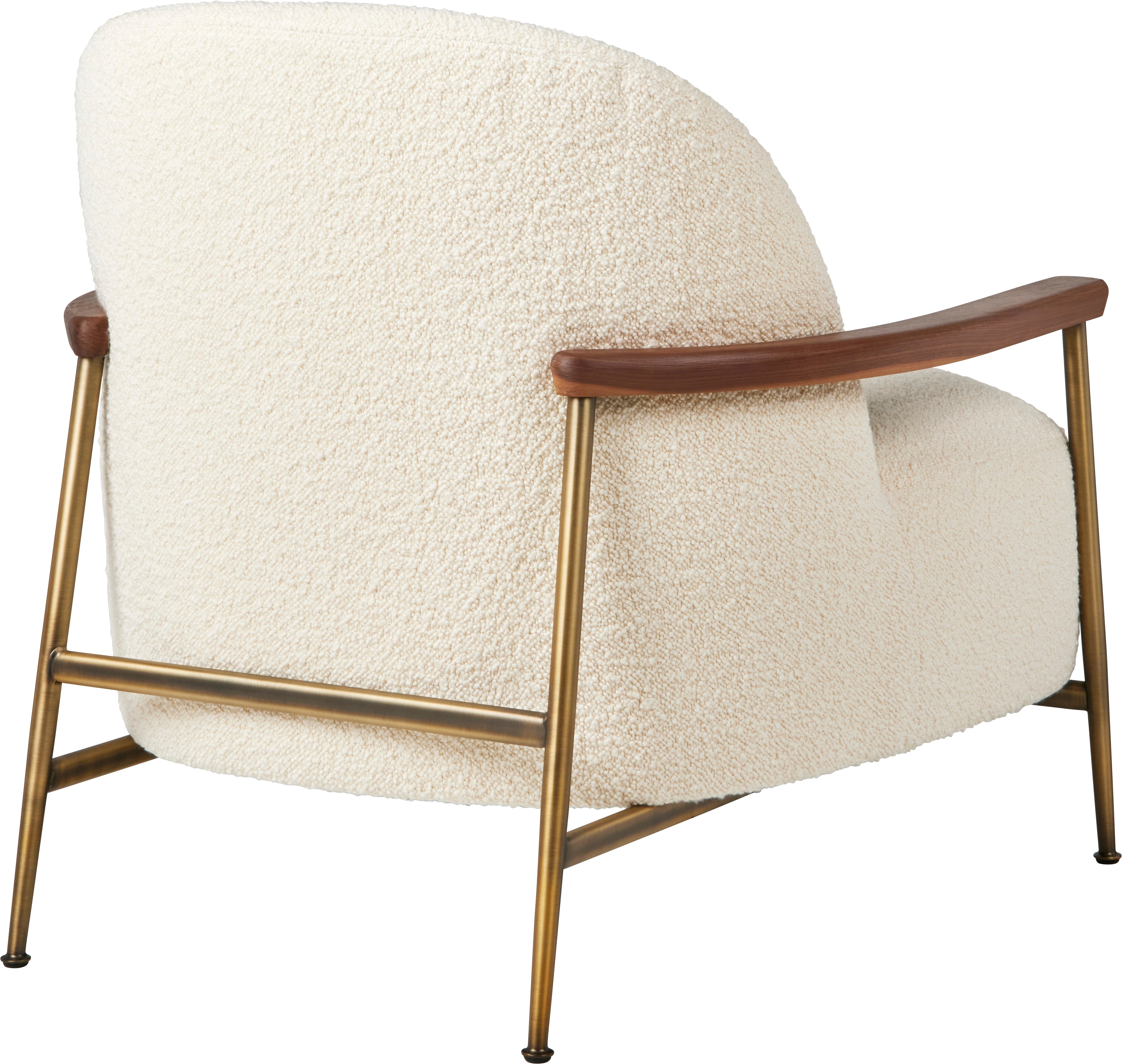 SEJOUR upholstered armchair with a brass base