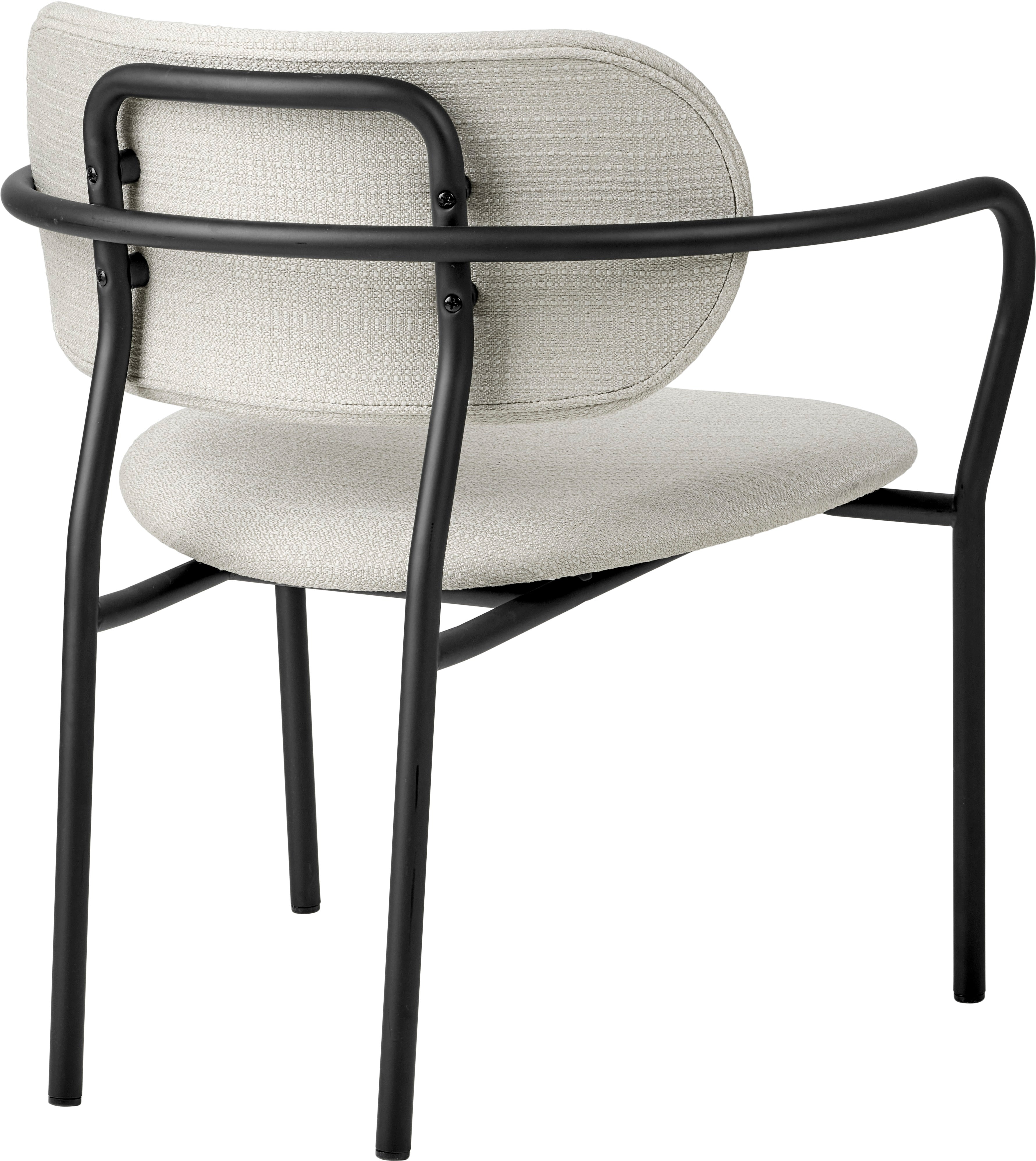 COCO upholstered armchair with a black base