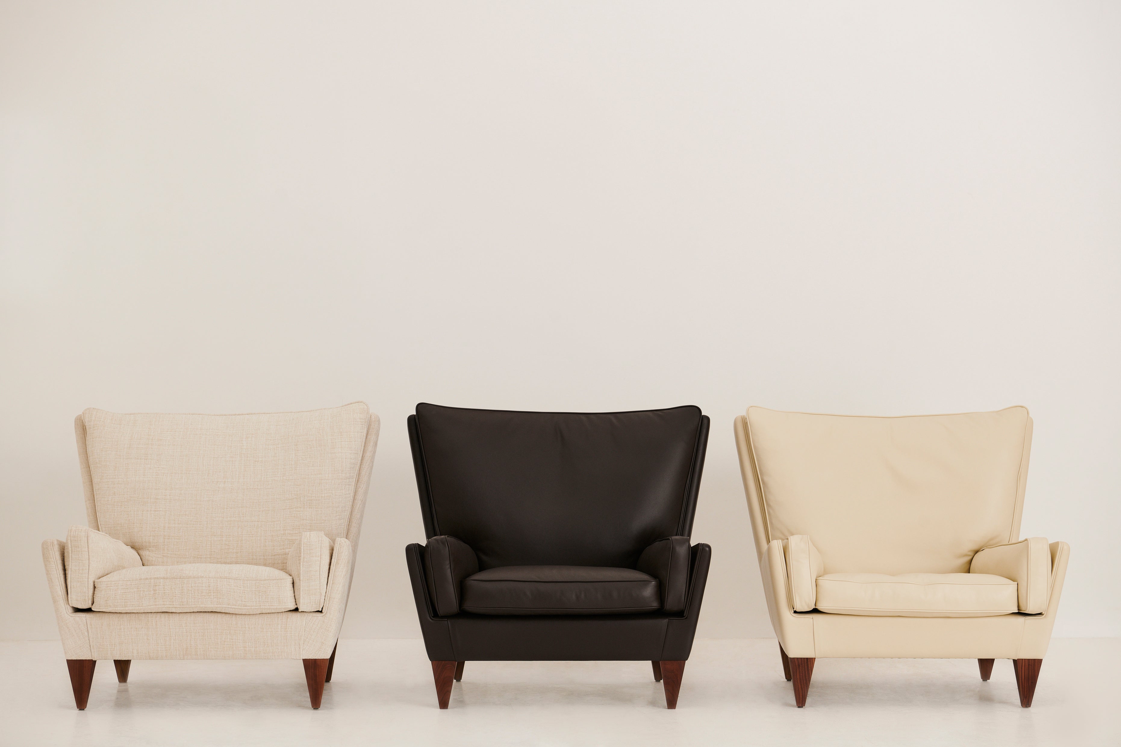 V11 Armchair upholstered with walnut base