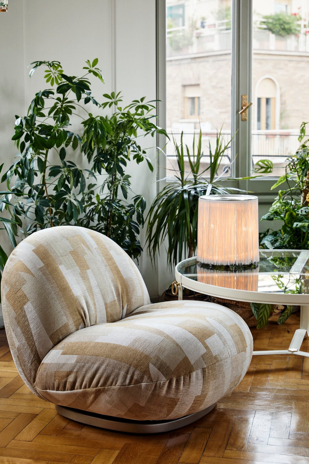 PACHA upholstered armchair with a black base