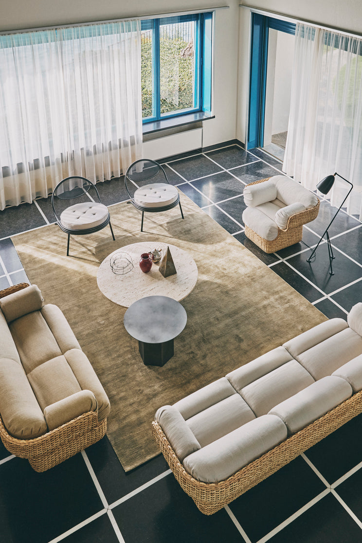 COPACABANA upholstered armchair with a black base