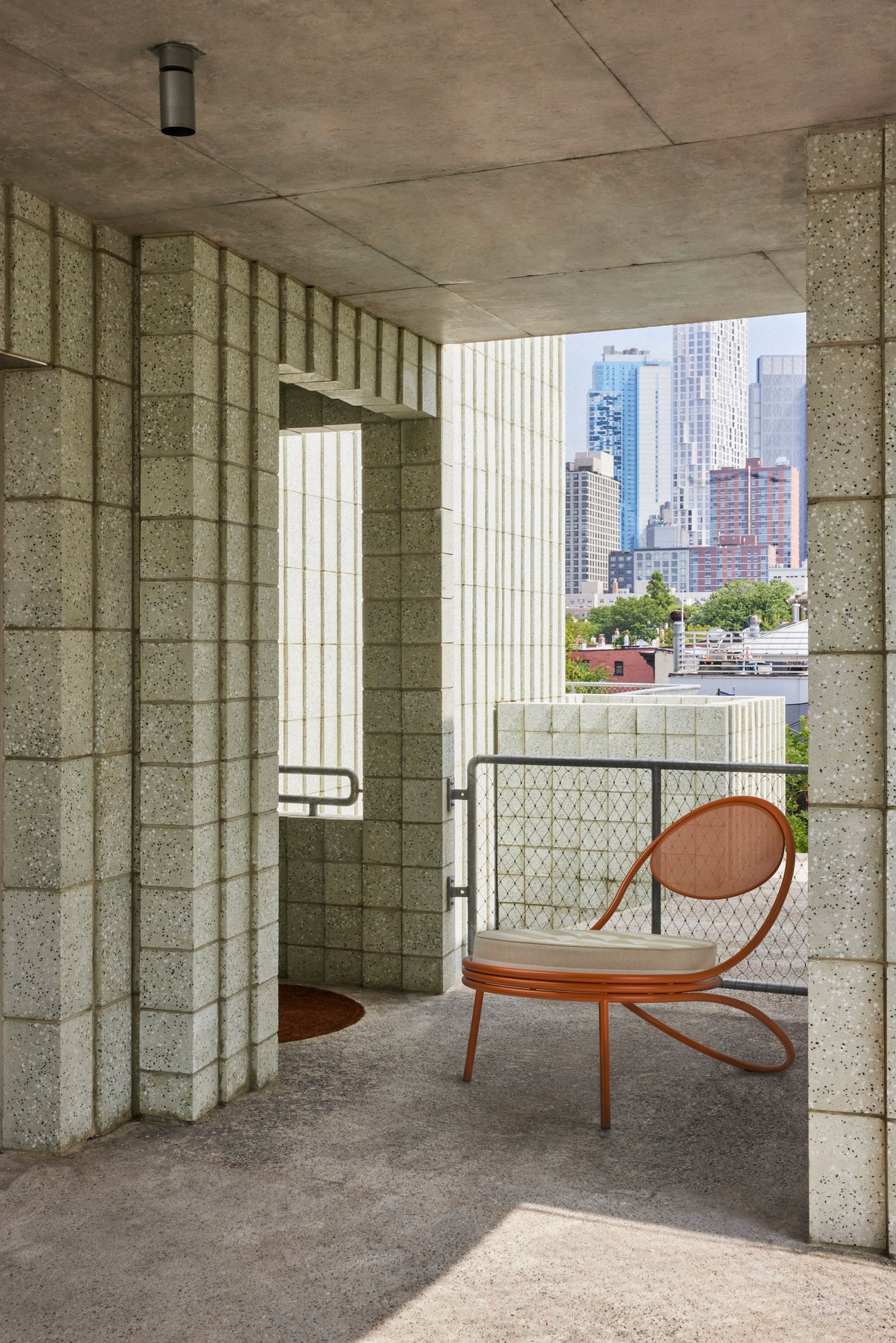 COPACABANA upholstered armchair with a black base