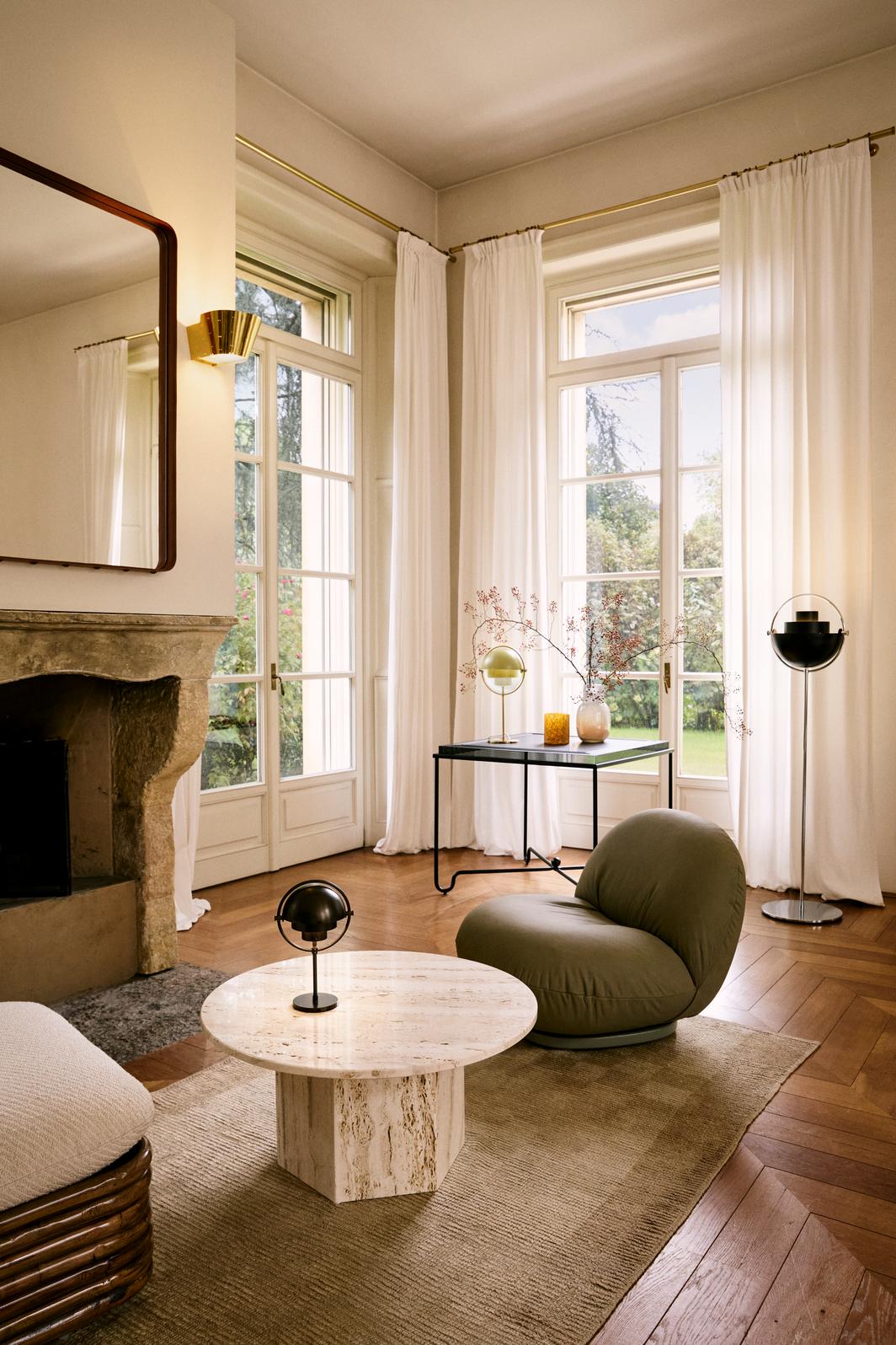 PACHA upholstered armchair with a black base