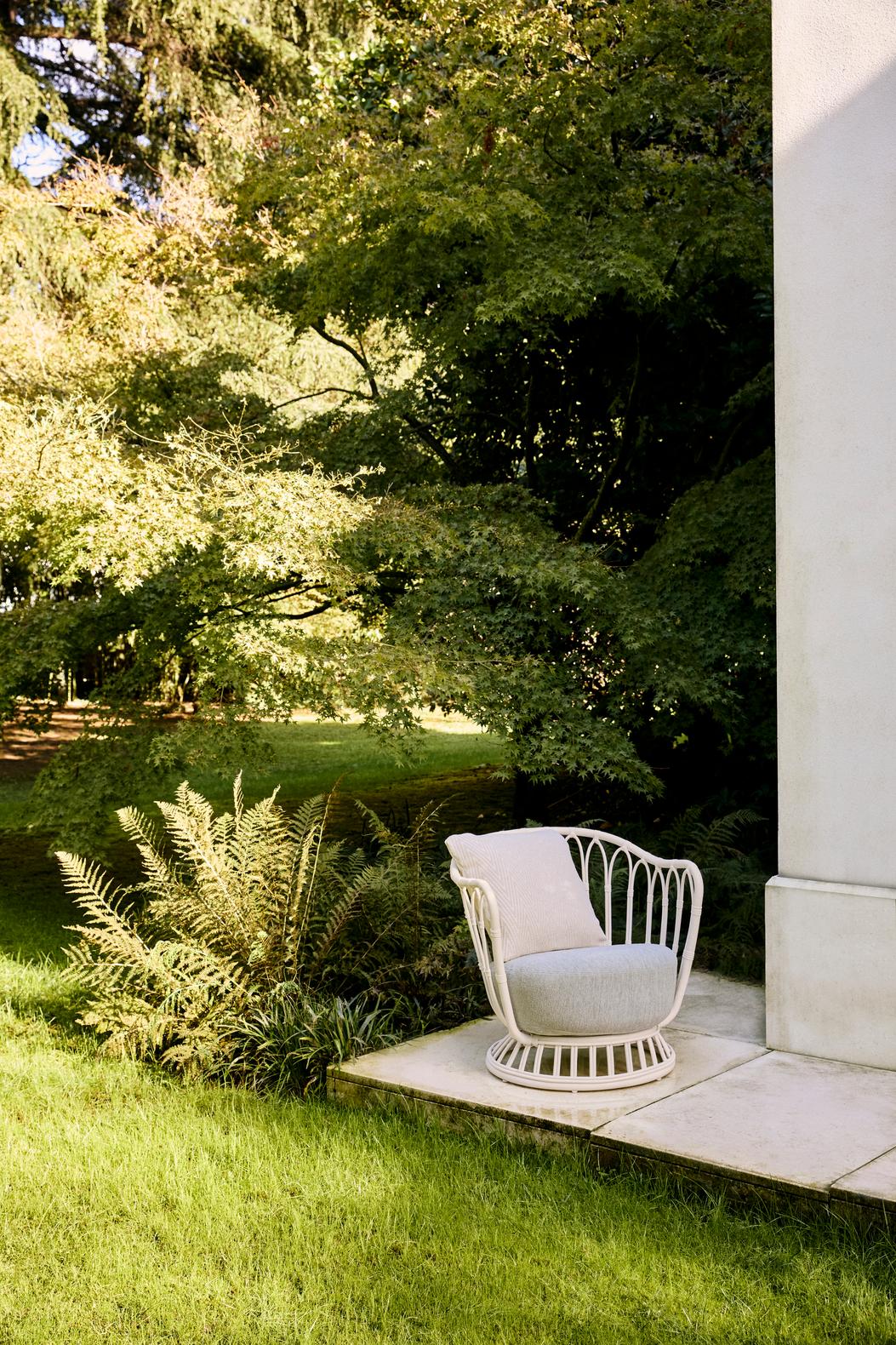 GRACE upholstered garden armchair with a black base