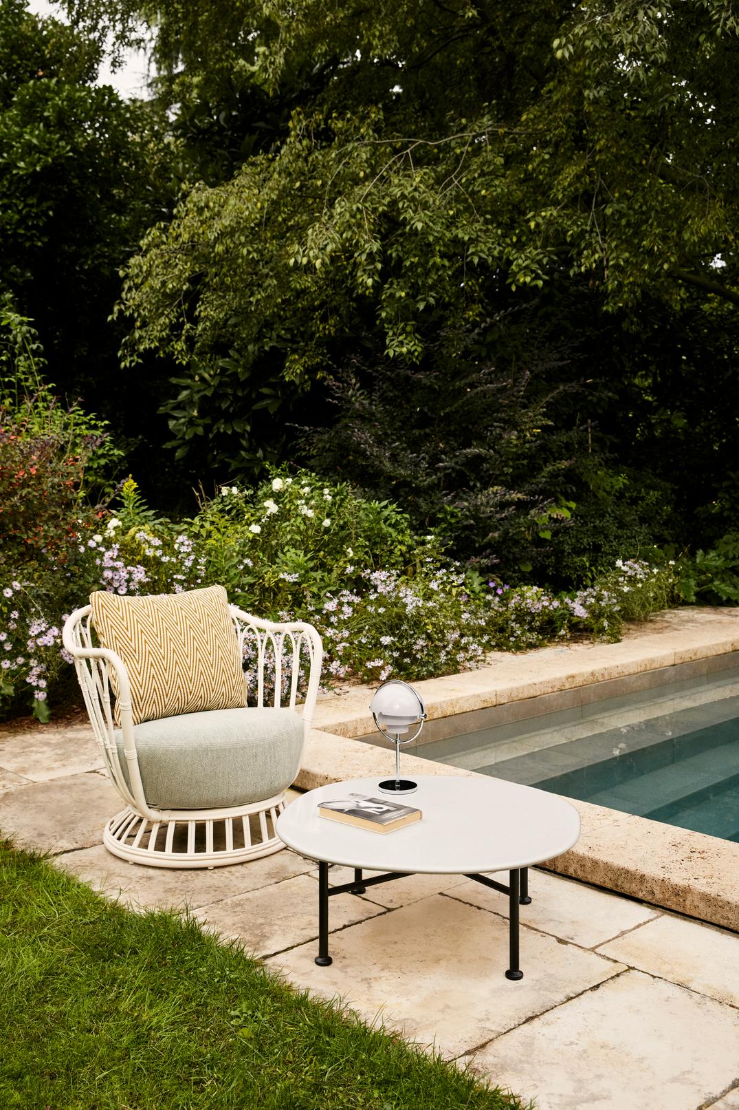 GRACE upholstered garden armchair with a black base