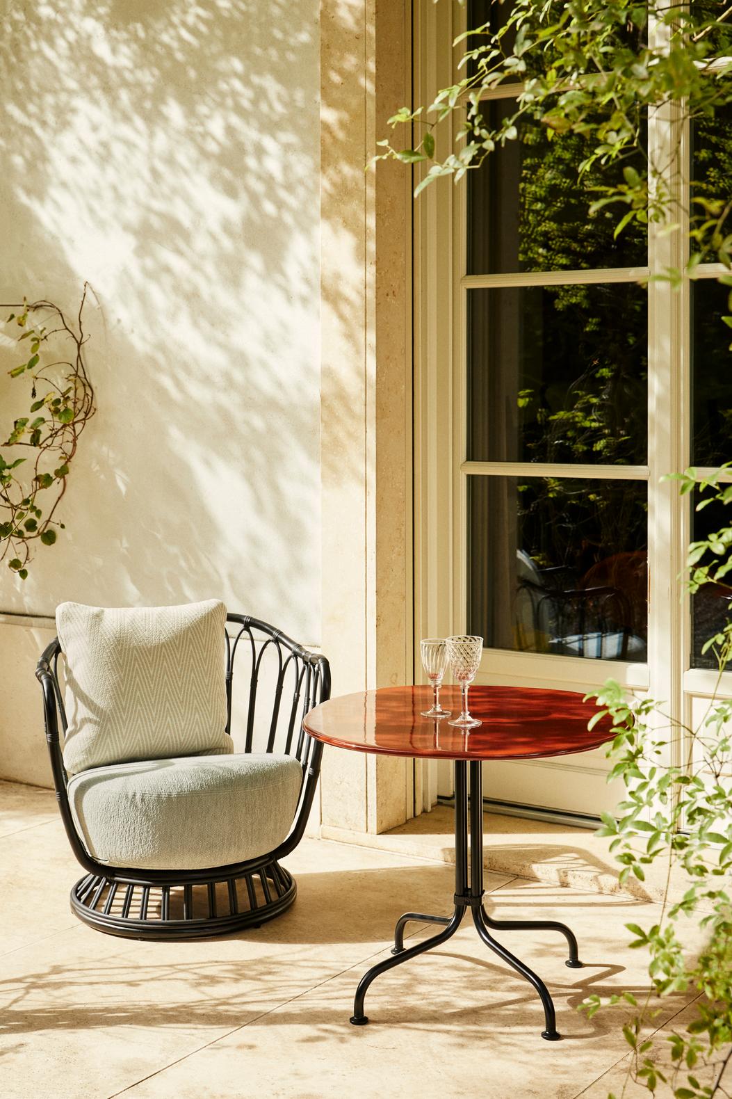 GRACE upholstered garden armchair with a black base