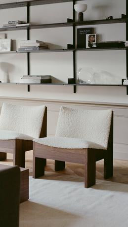 Tenon upholstered armchair with a dark oak base