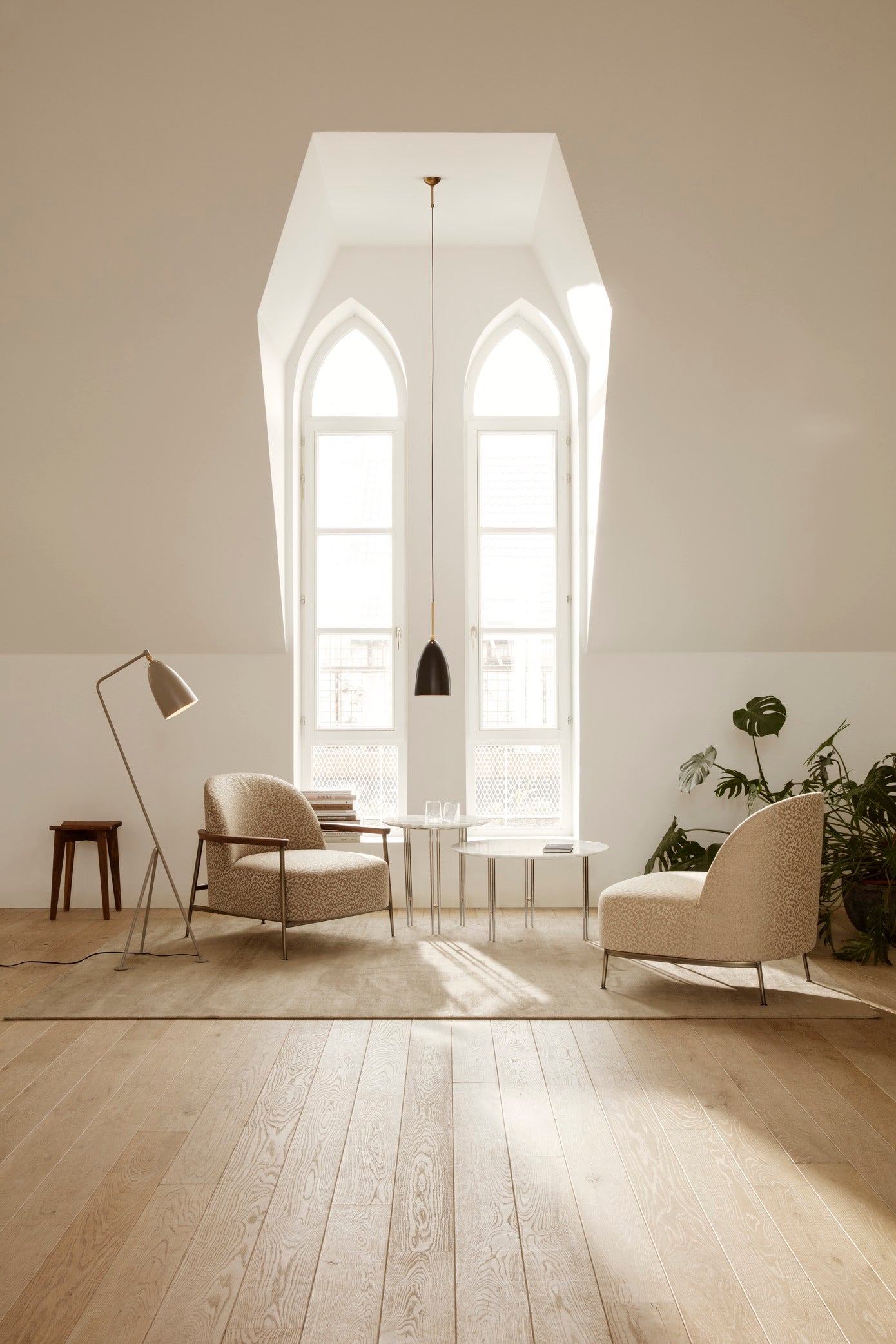 SEJOUR upholstered armchair with black base