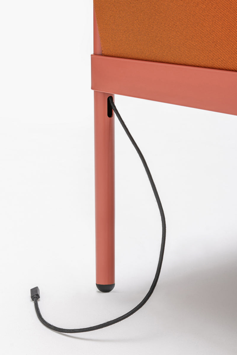 Low upholstered stilt armchair