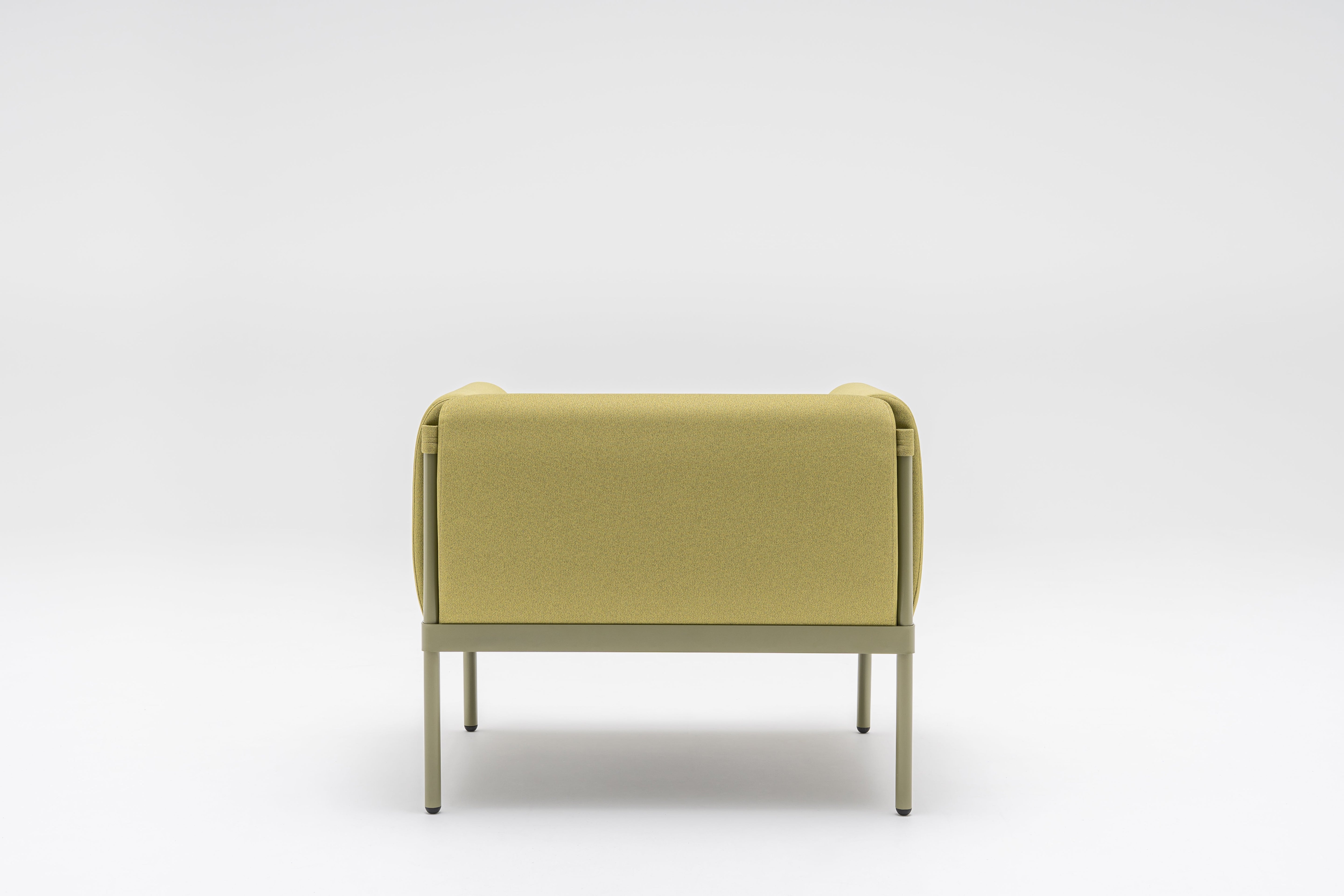 Low upholstered stilt armchair