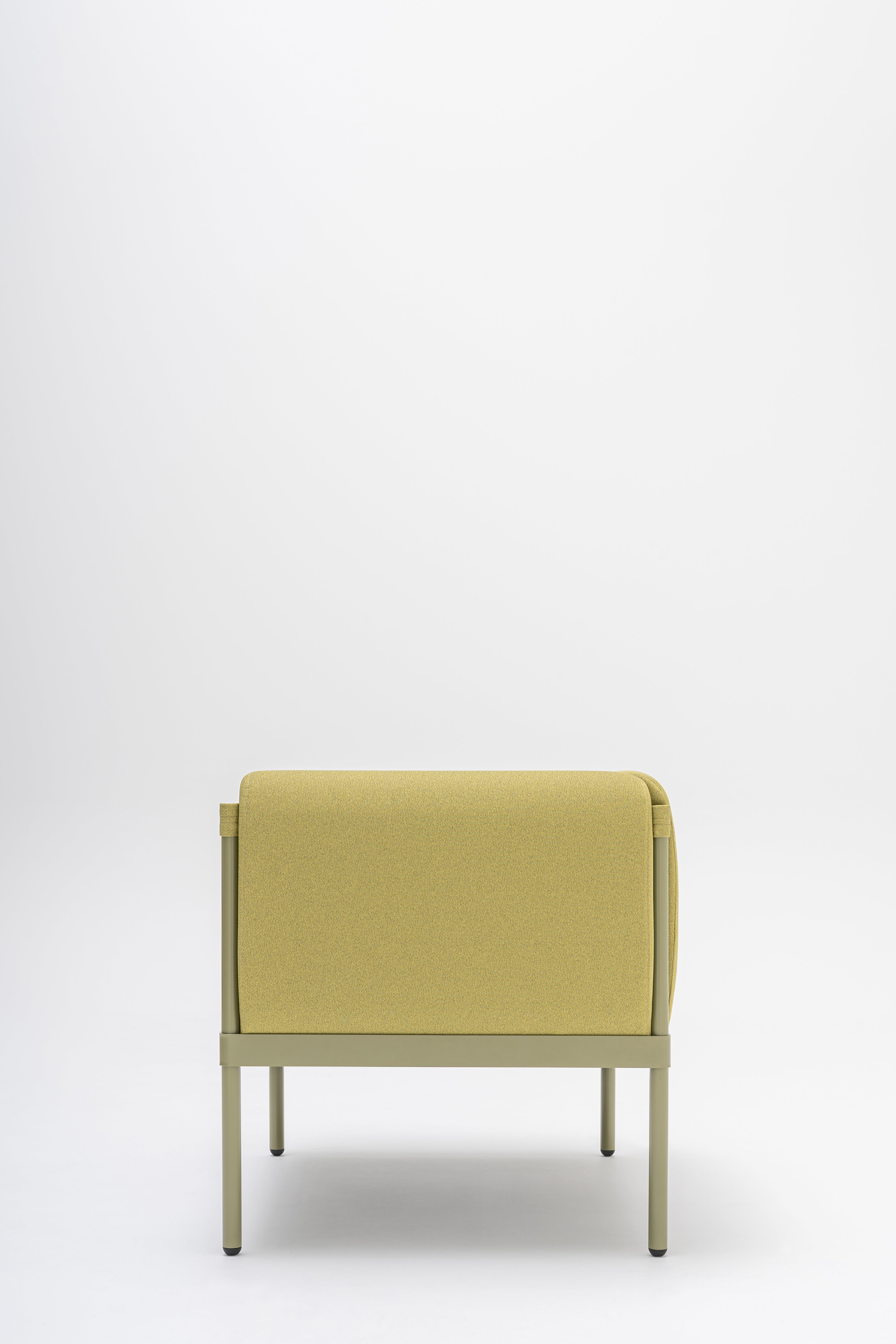 Low upholstered stilt armchair