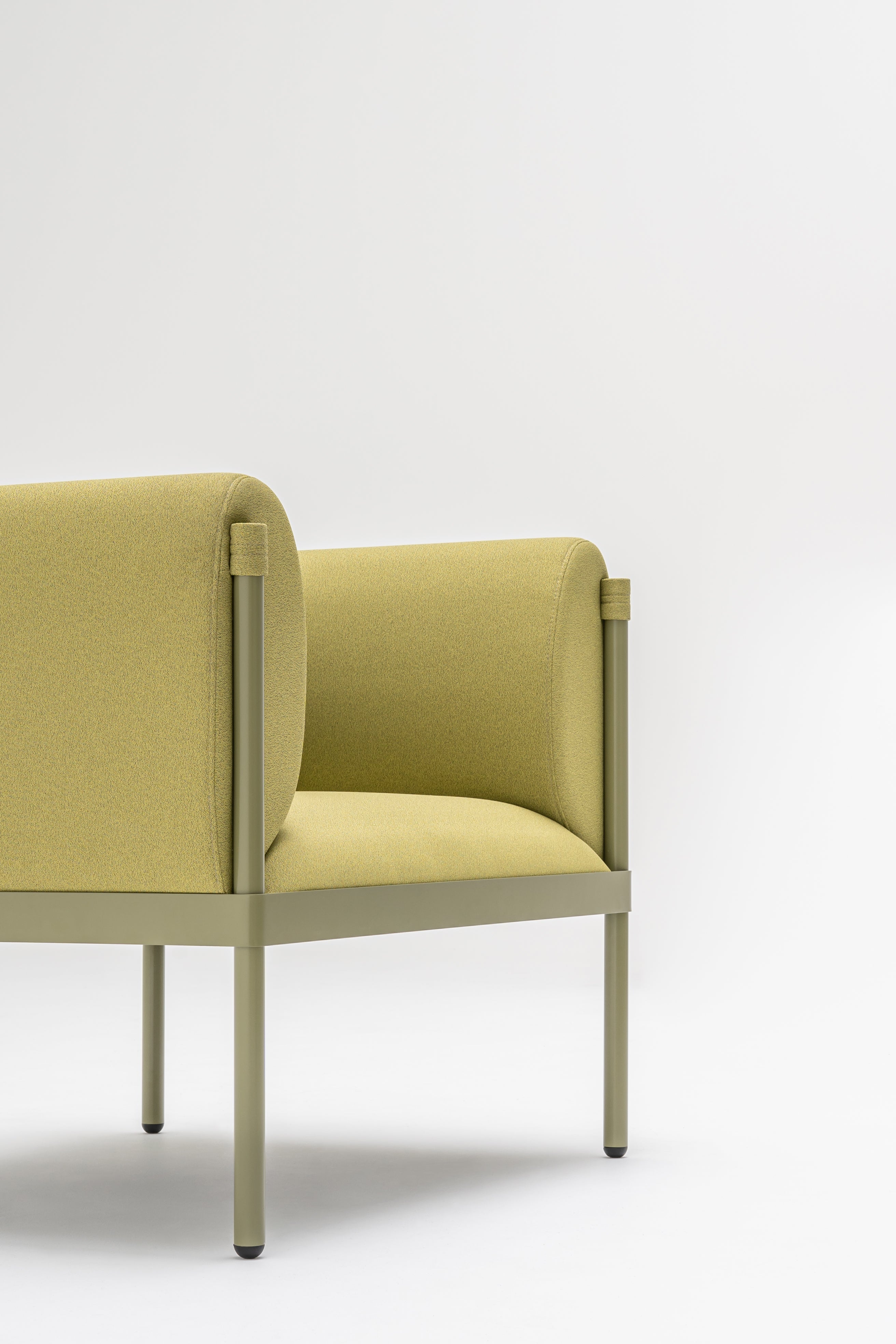 Low upholstered stilt armchair
