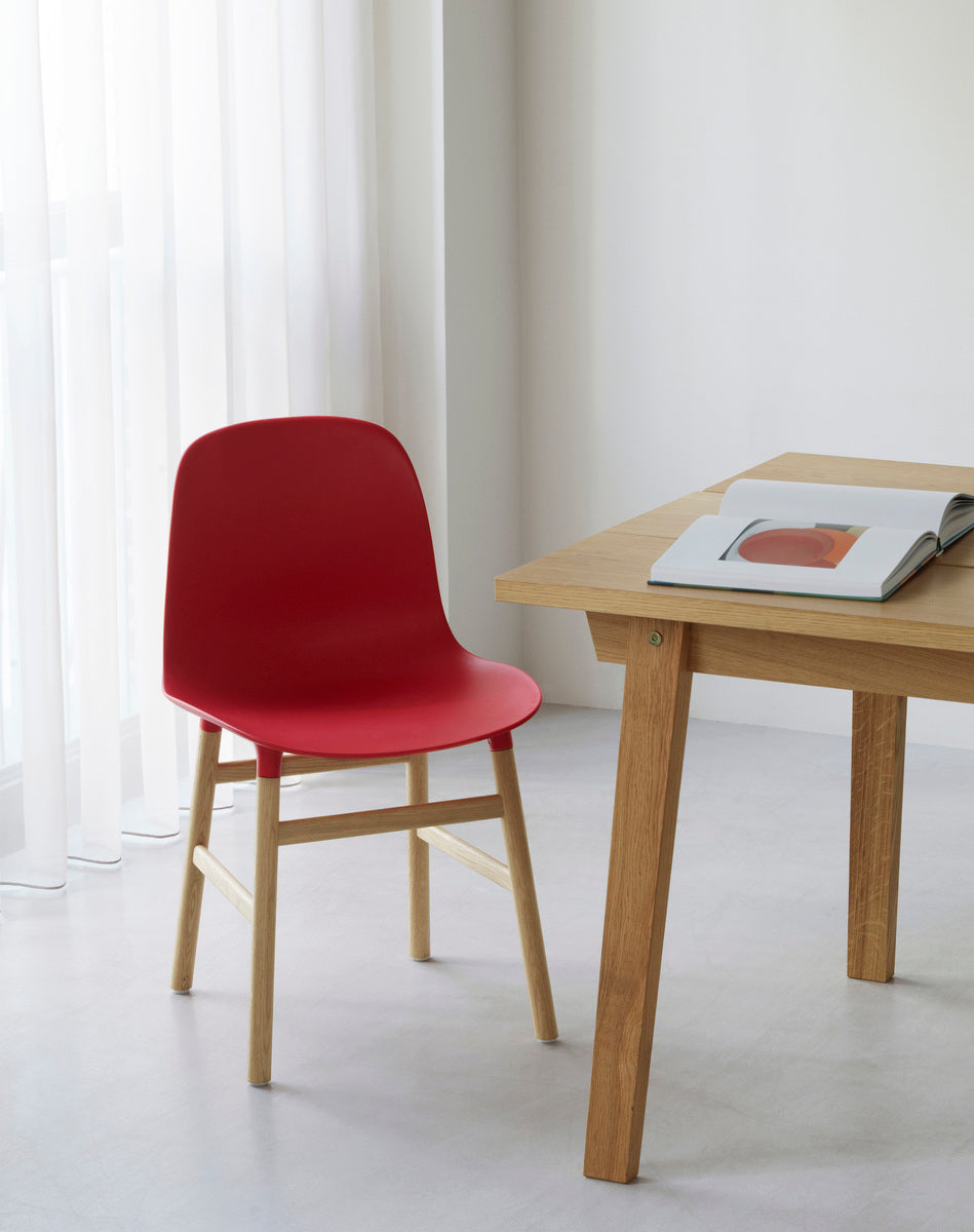 Chair burgundy forms with an oak base
