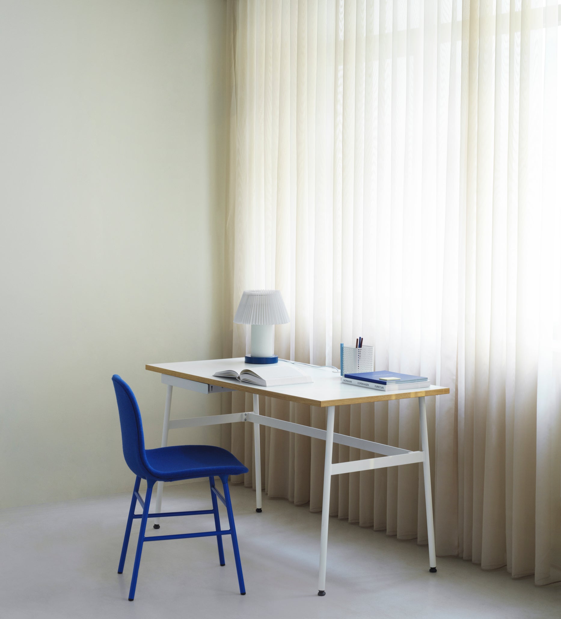 Upholstered chair with a green base