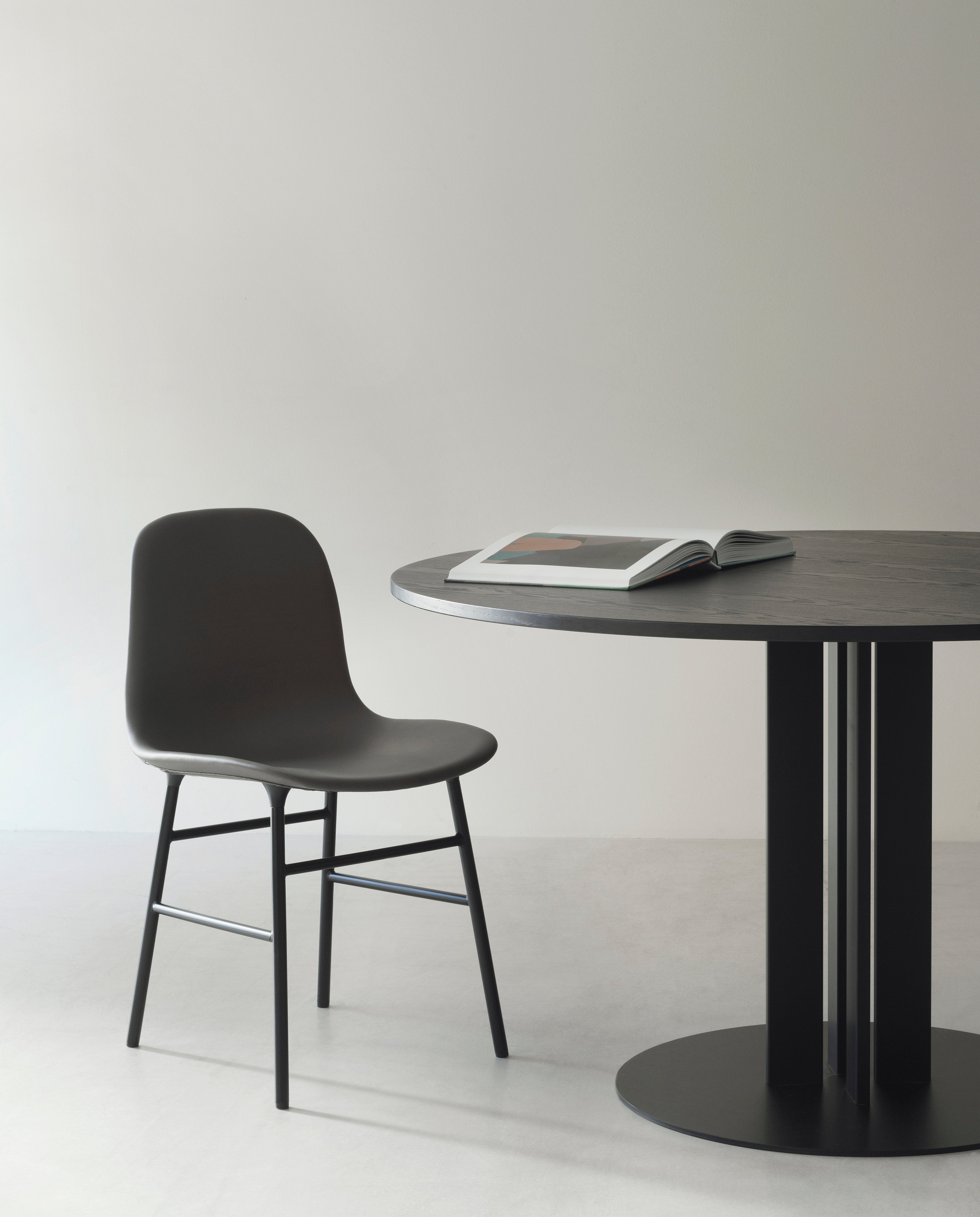 Black Form Chair with a golden base