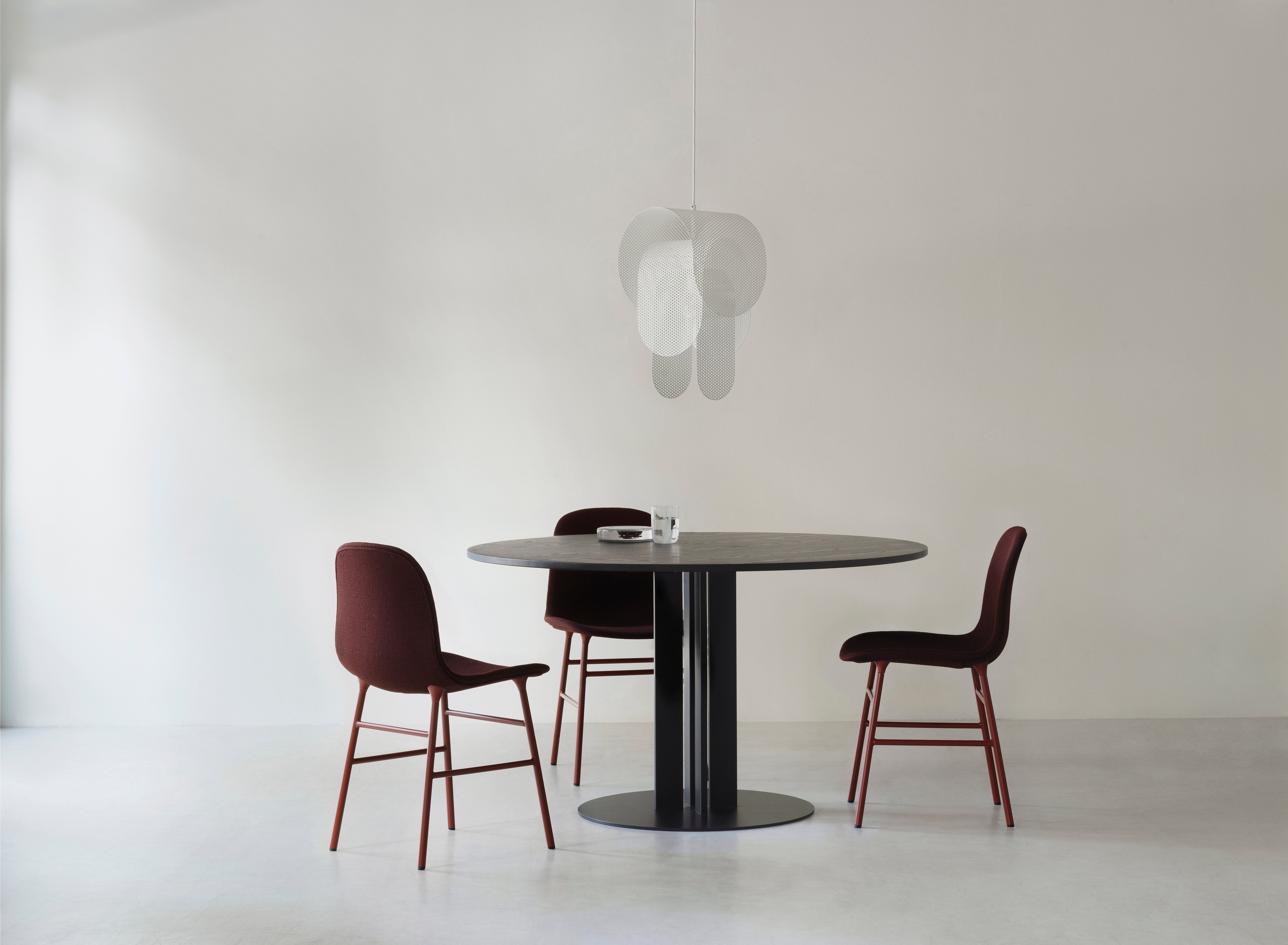 Upholstered chair forms with a chrome base
