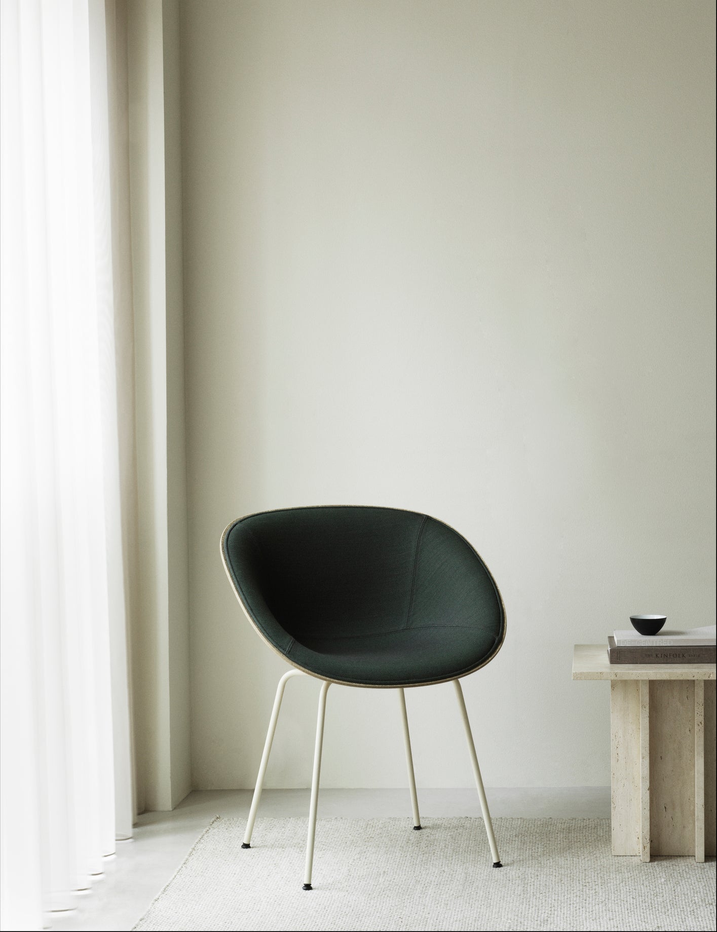 Armchair upholstered chair with a cream base