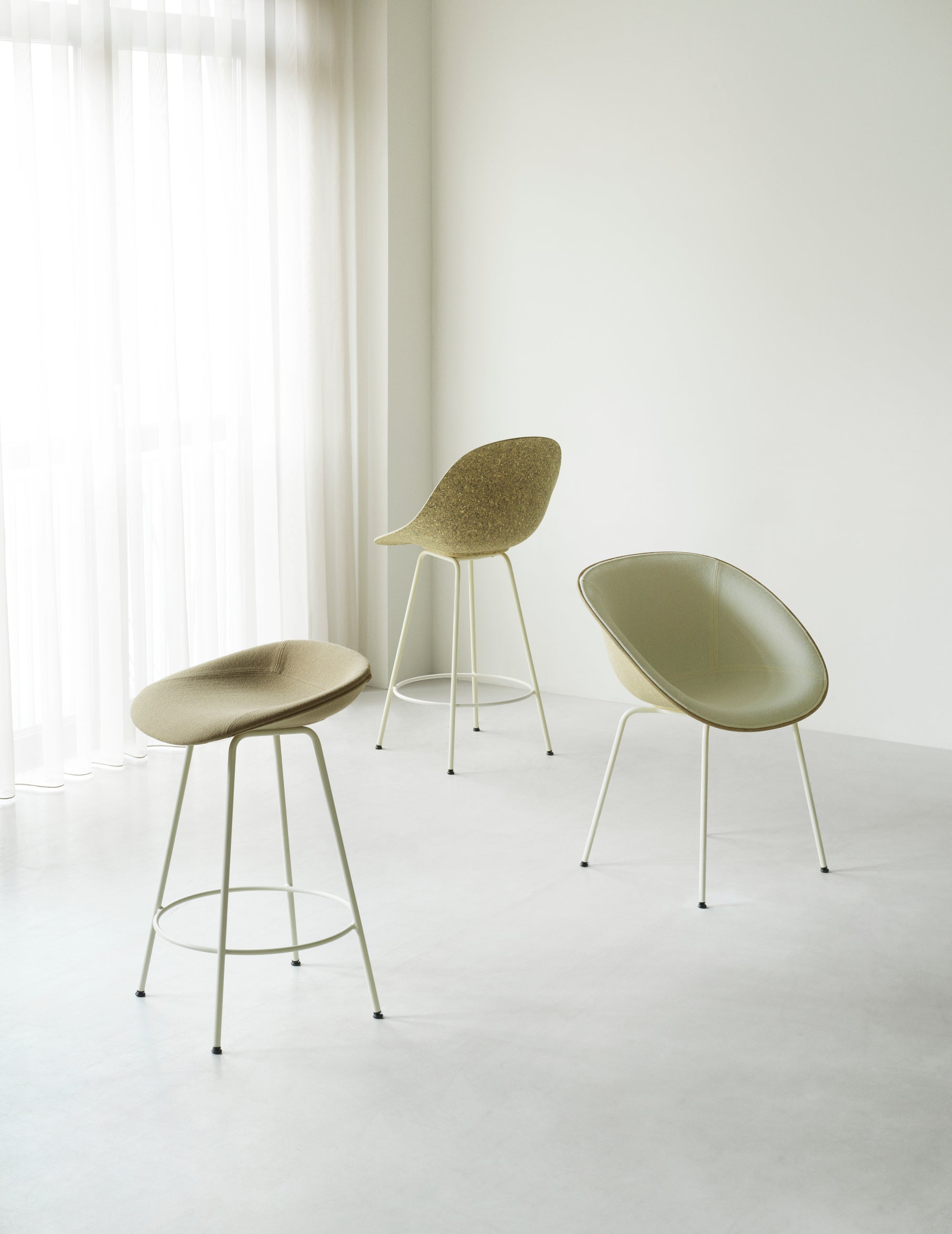 Armchair upholstered chair with a cream base