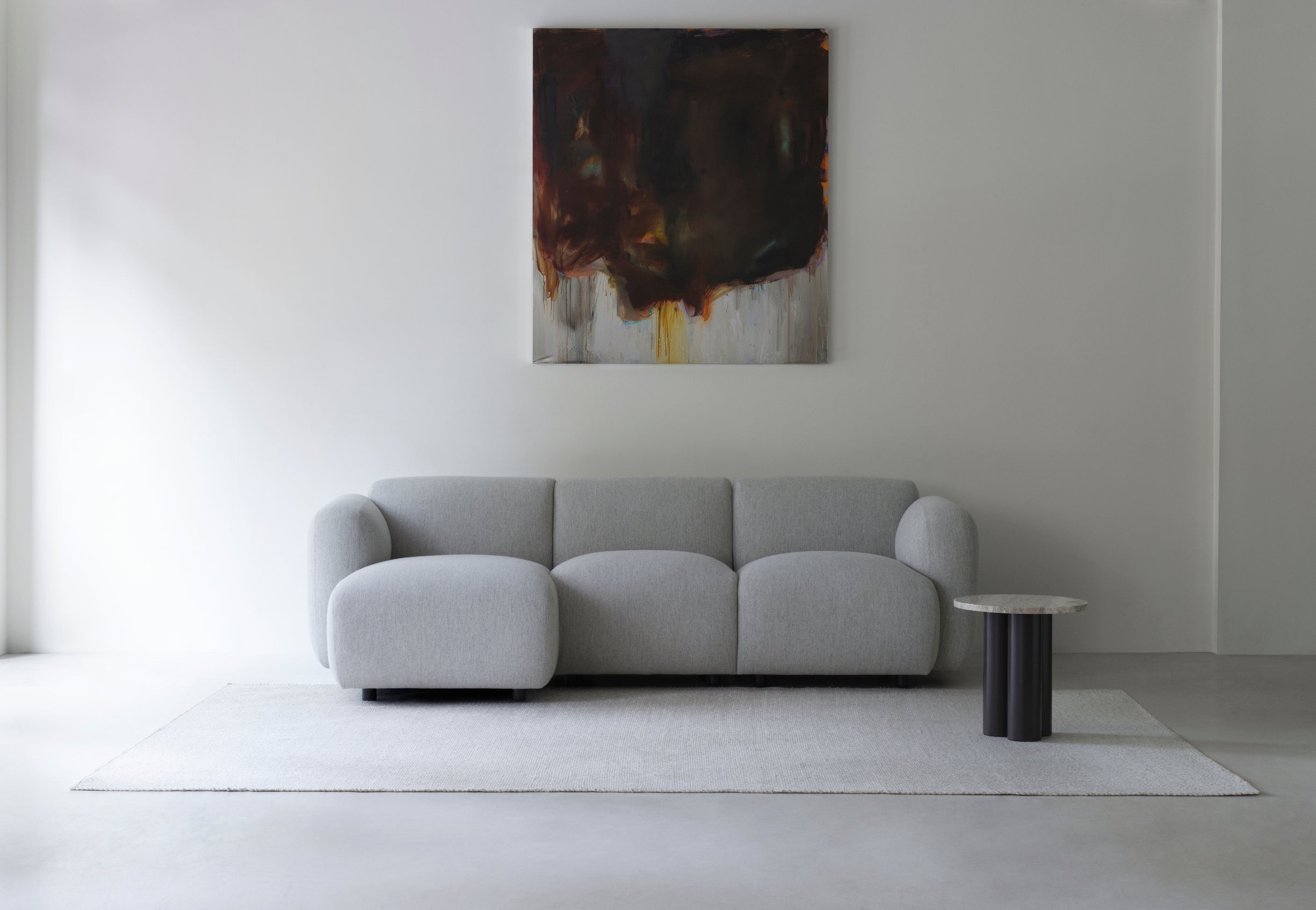 The rug is dark gray