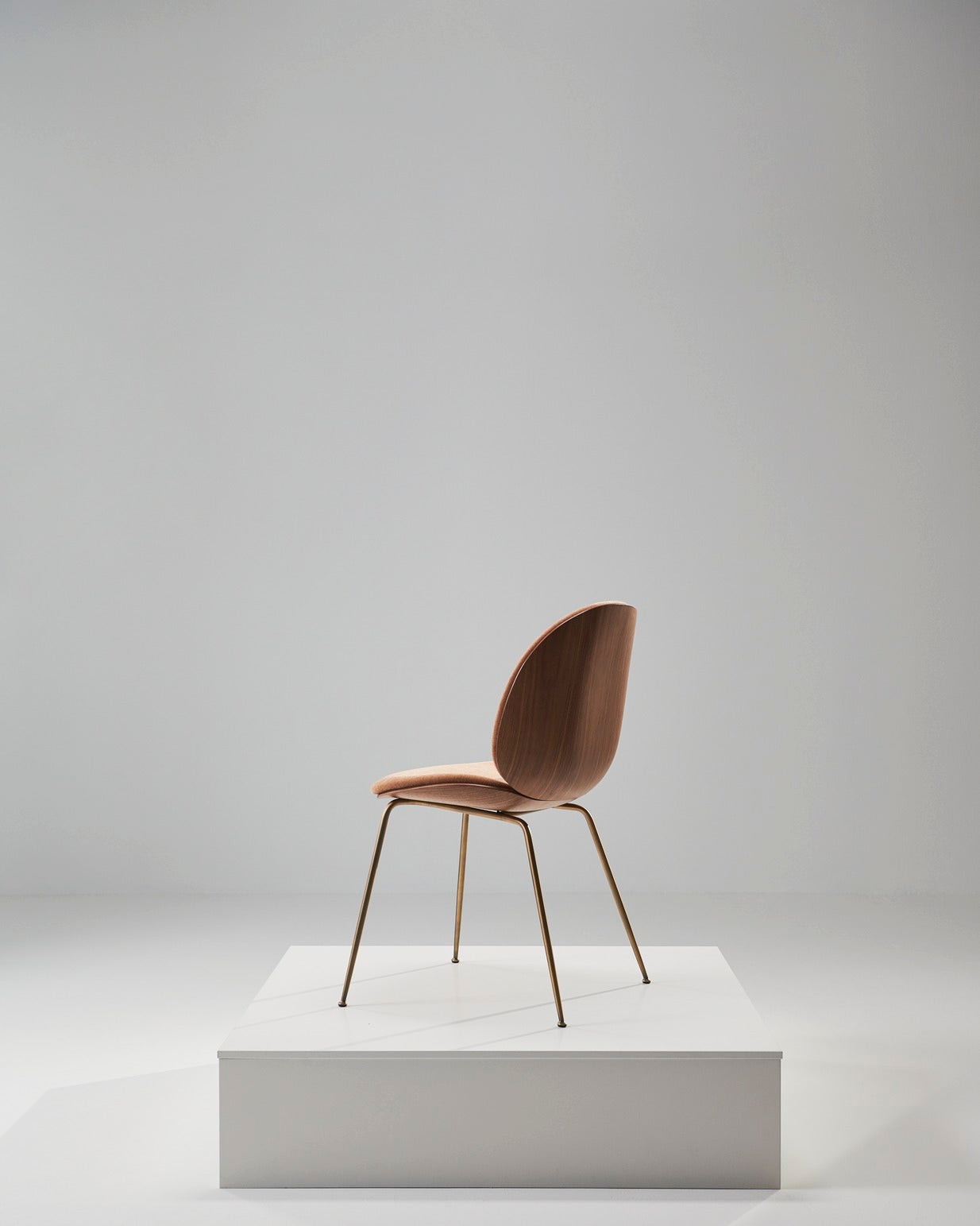 BEETLE upholstered chair with walnut wood and black chrome base