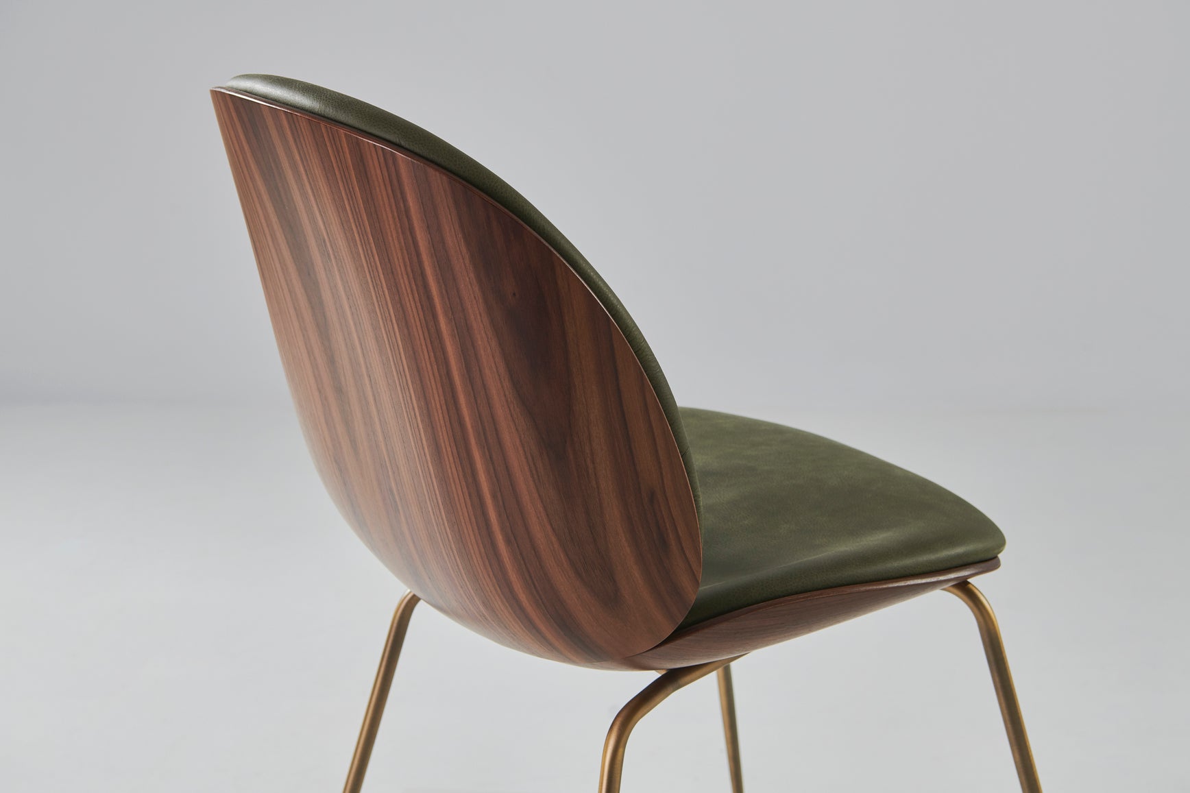 BEETLE upholstered chair with walnut wood and black chrome base