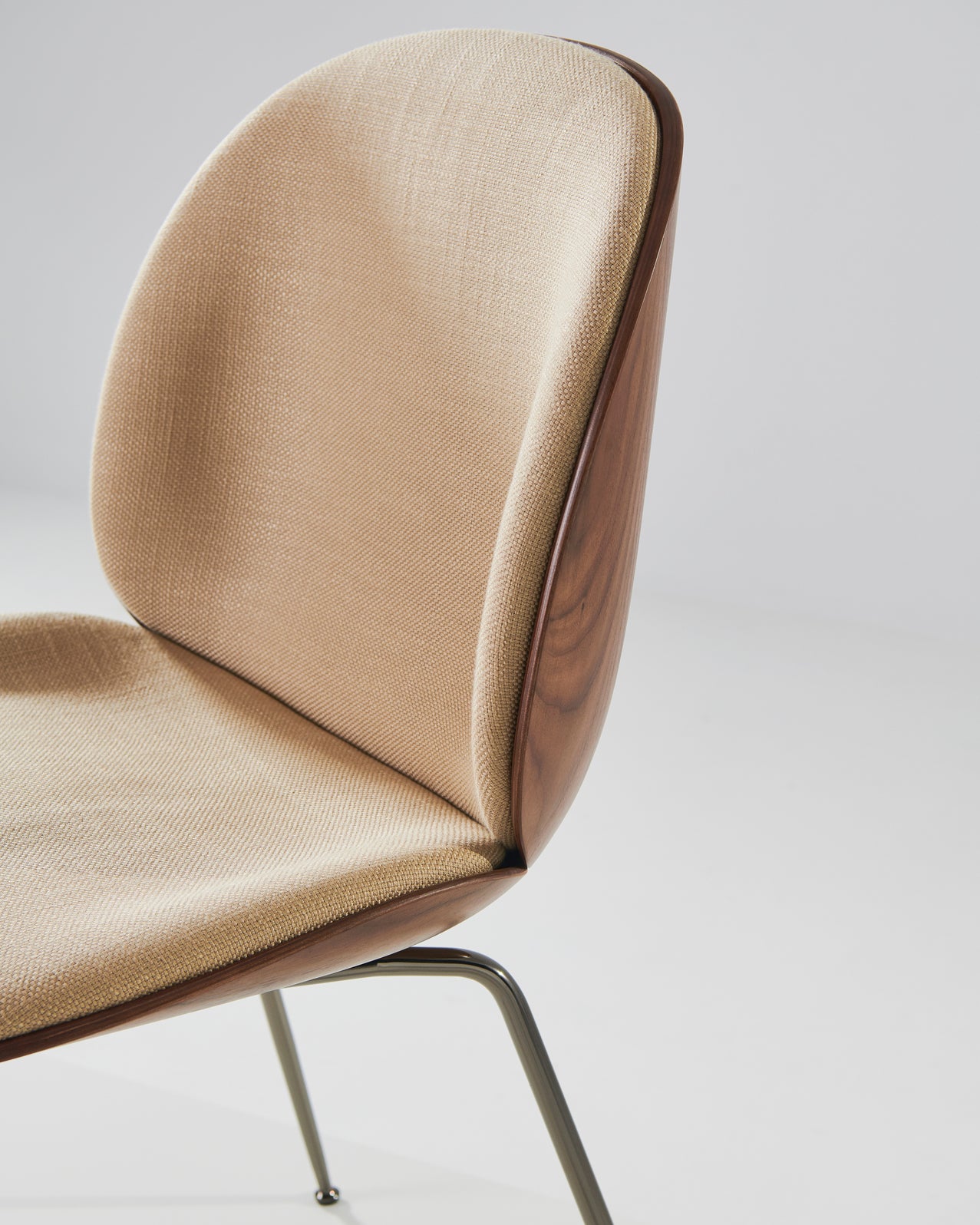 BEETLE upholstered chair with walnut wood and black chrome base