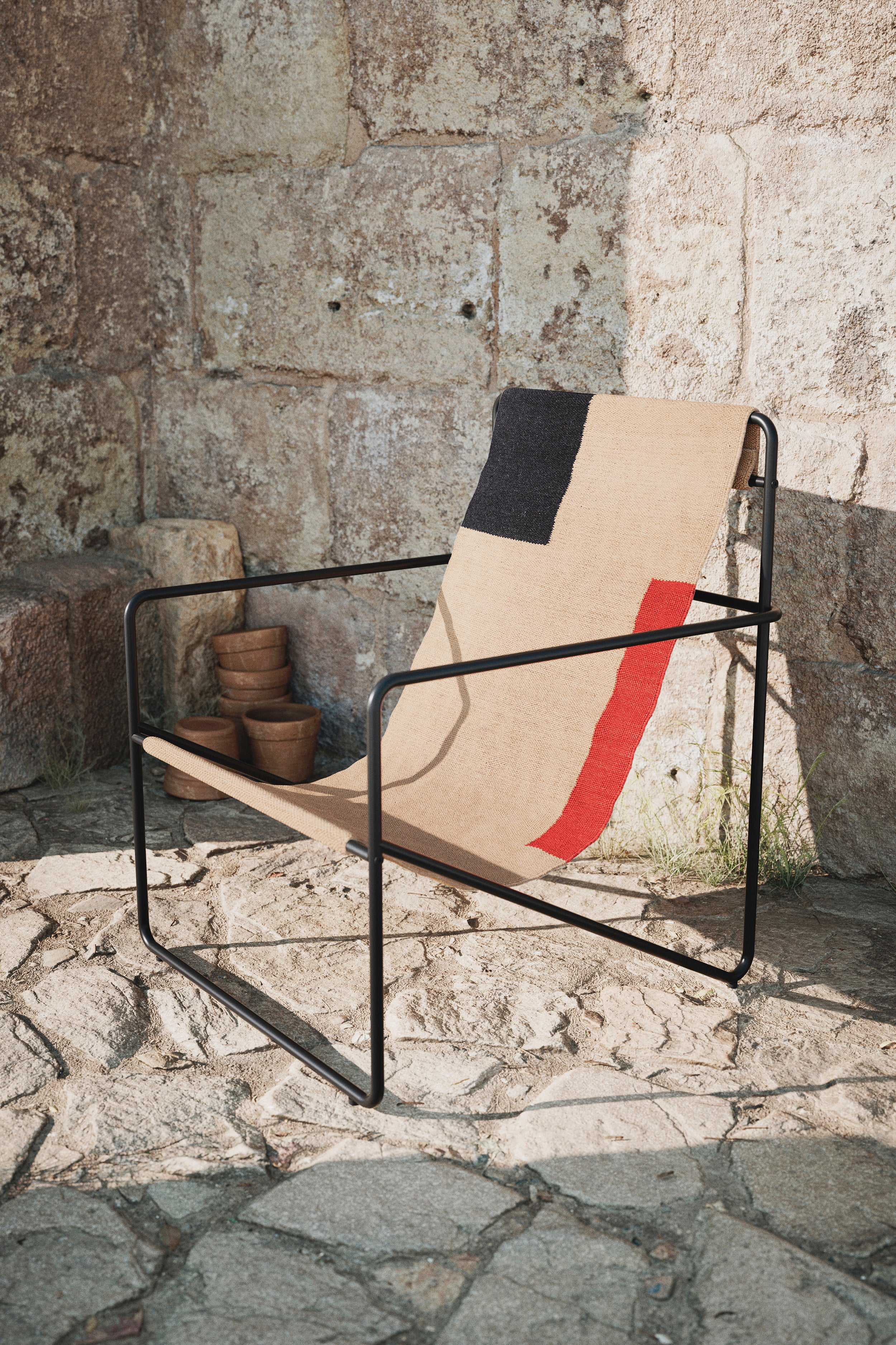 Desert beige-red garden armchair with a black base