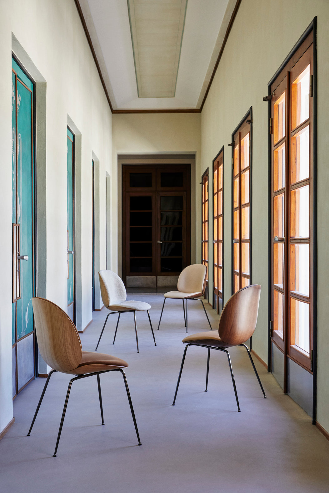 BEETLE upholstered chair with walnut wood and black chrome base