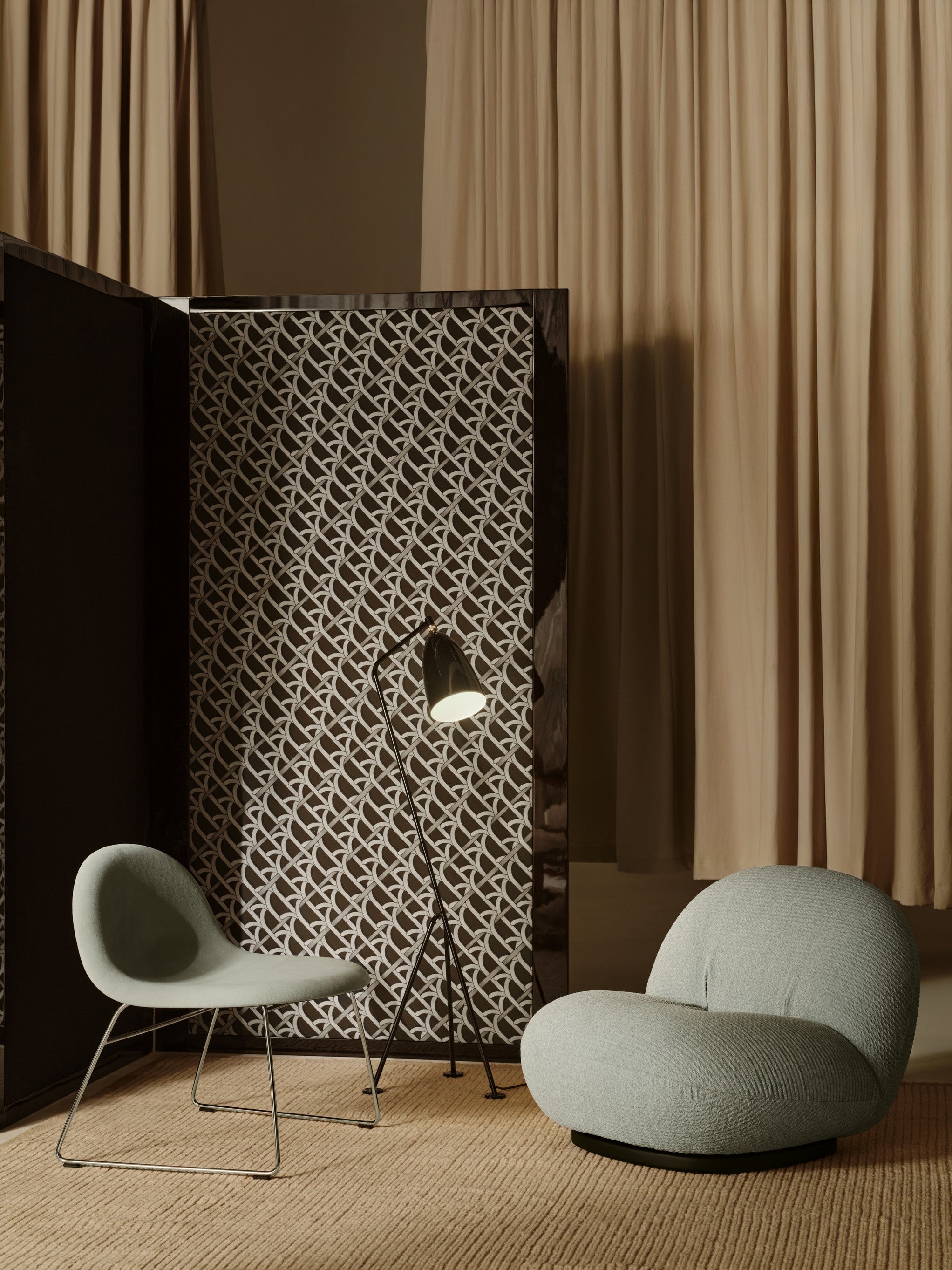 PACHA upholstered armchair with a black base