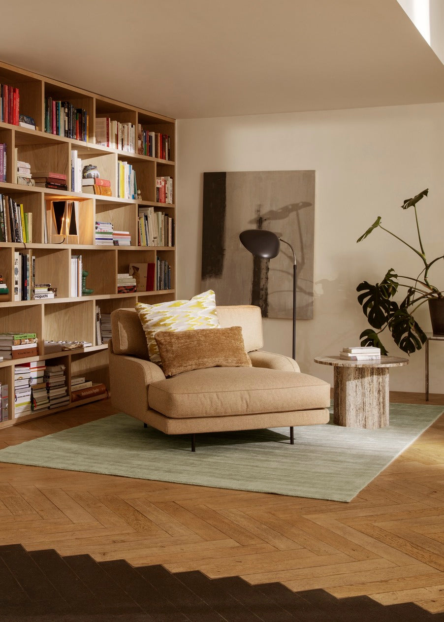 Upholstered FLANEUR armchair with a brass base