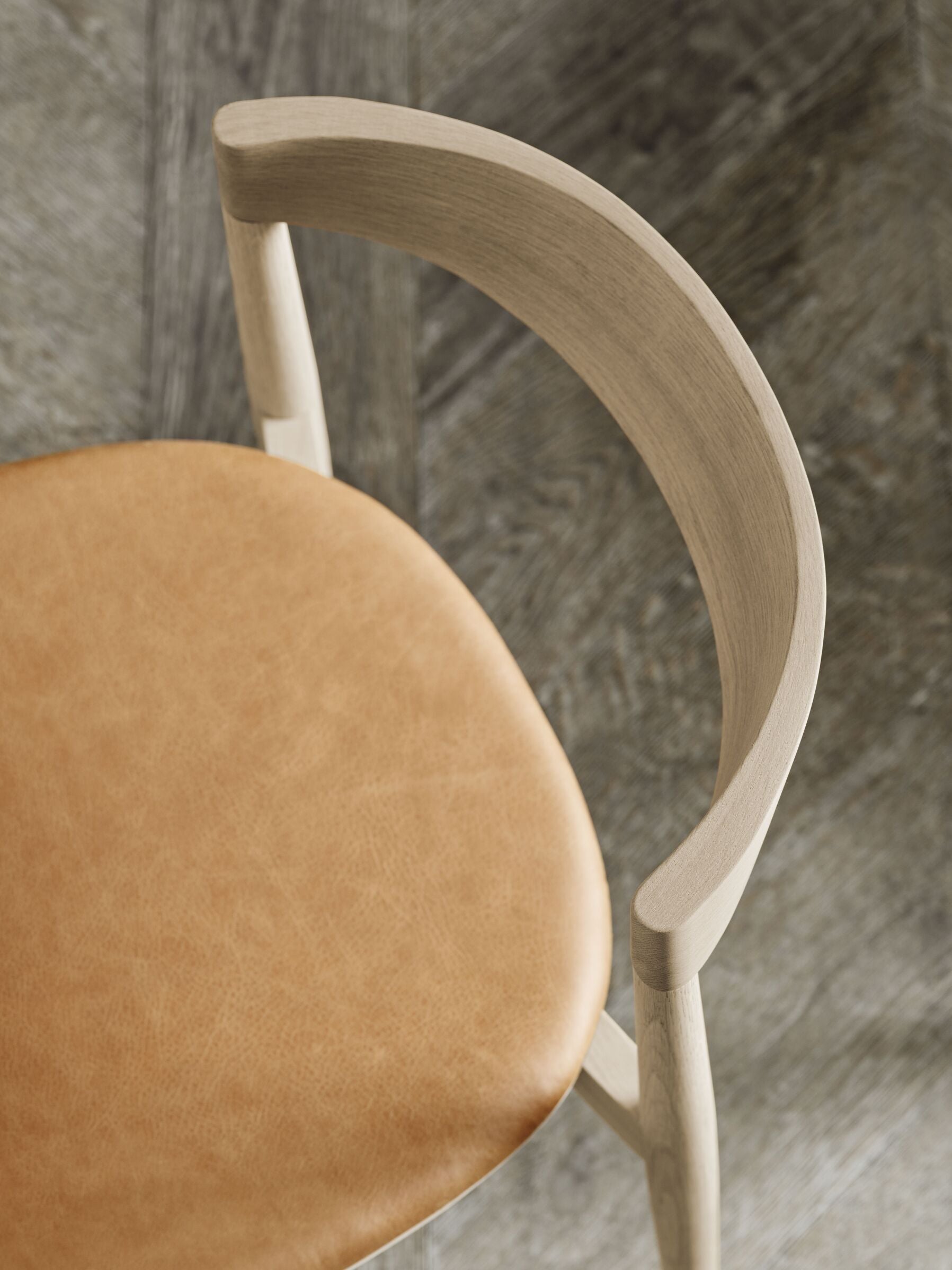 Kite upholstered chair with a dark base