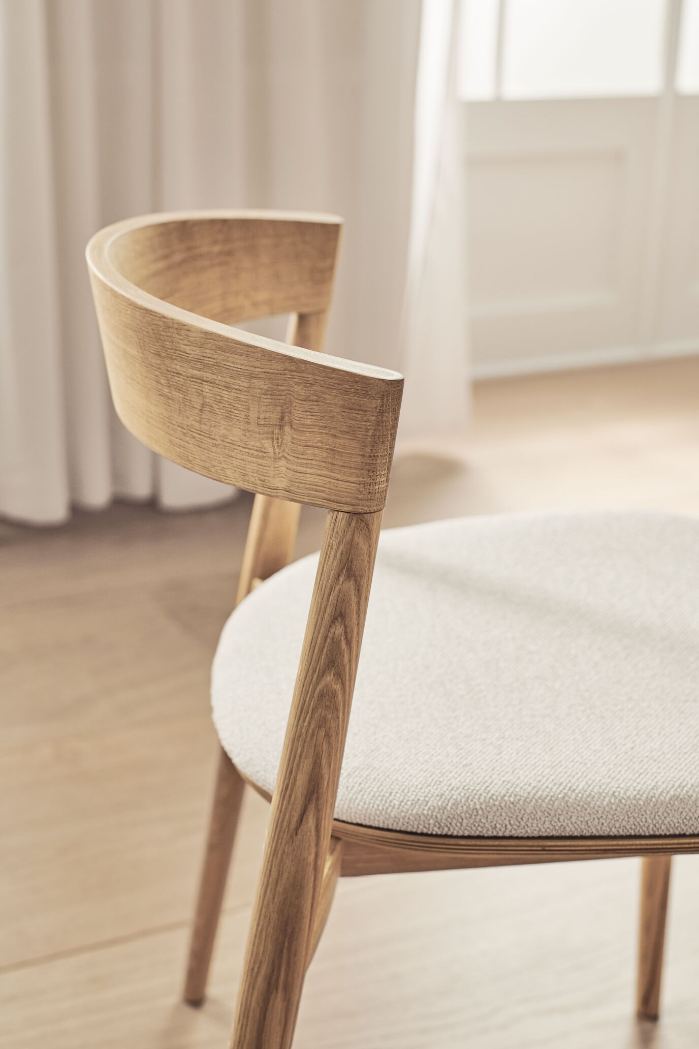 Kite upholstered chair with a whitened base