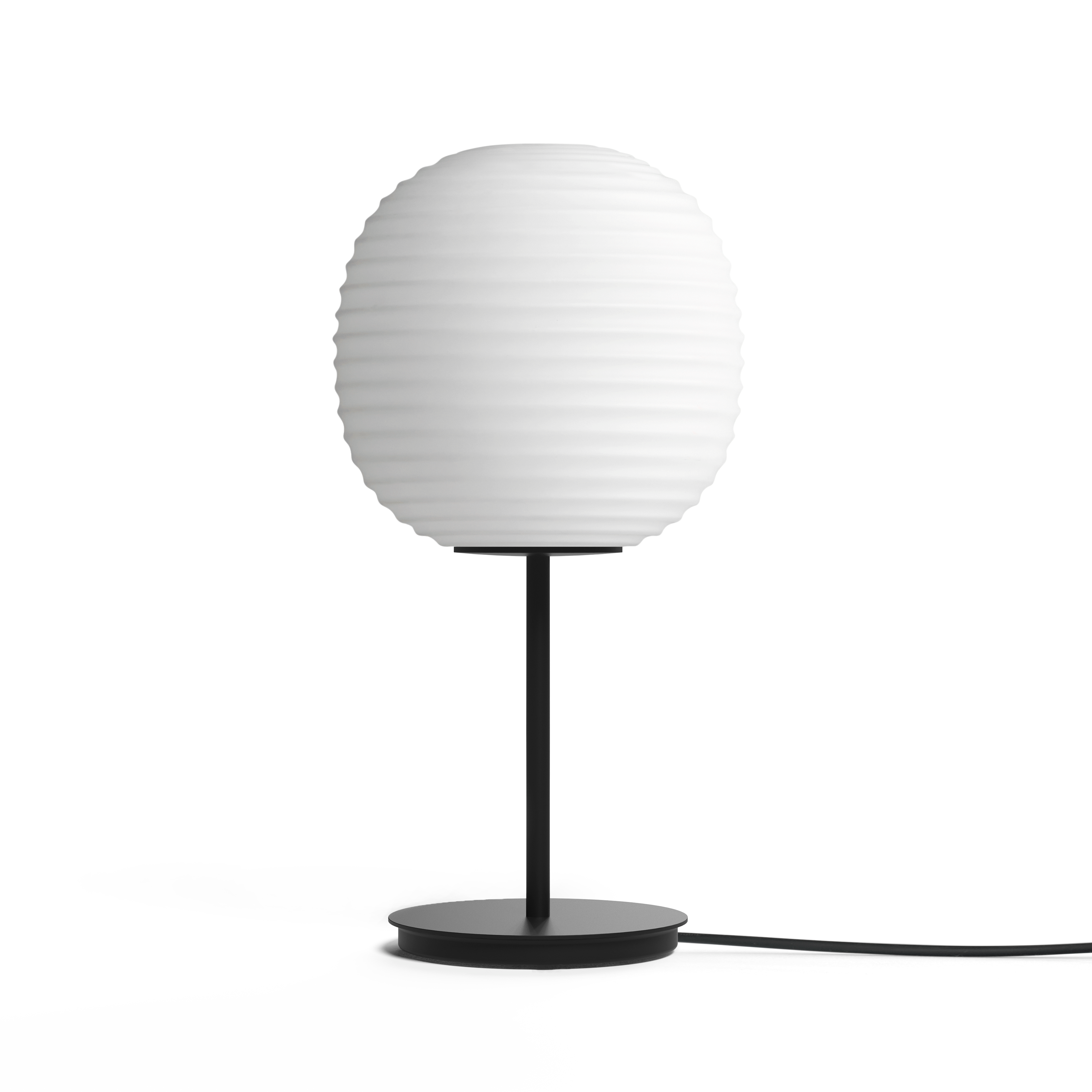 Lantern white table lamp with a black base