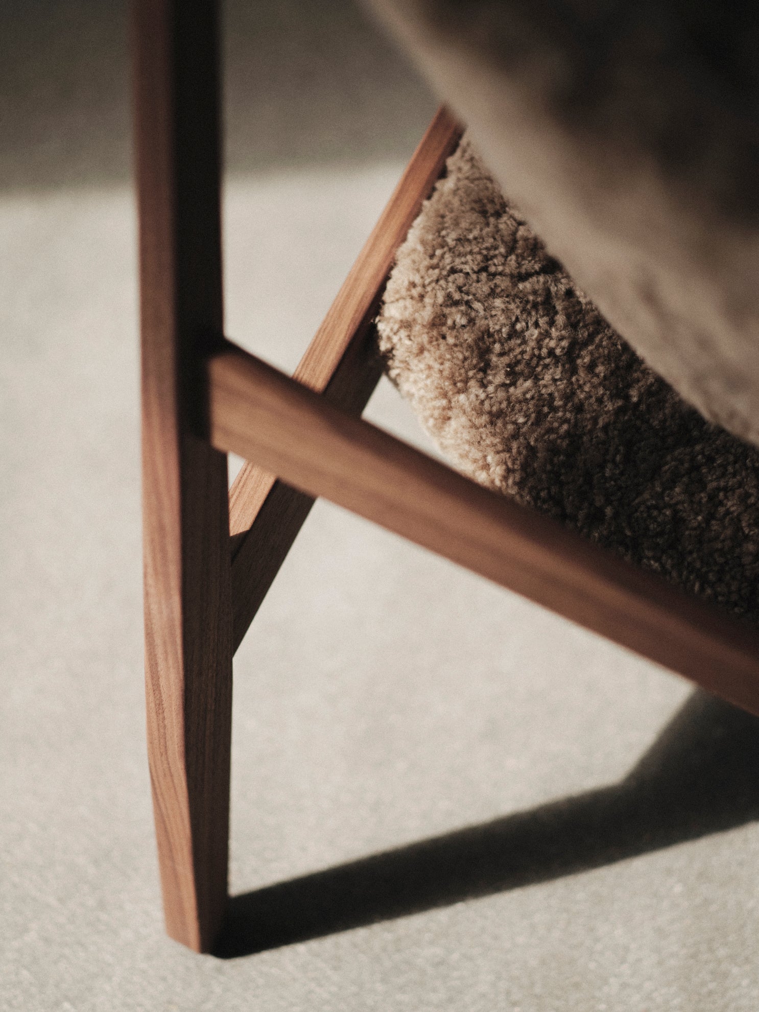 KNITTING armchair dark brown sheep leather with dark oak base