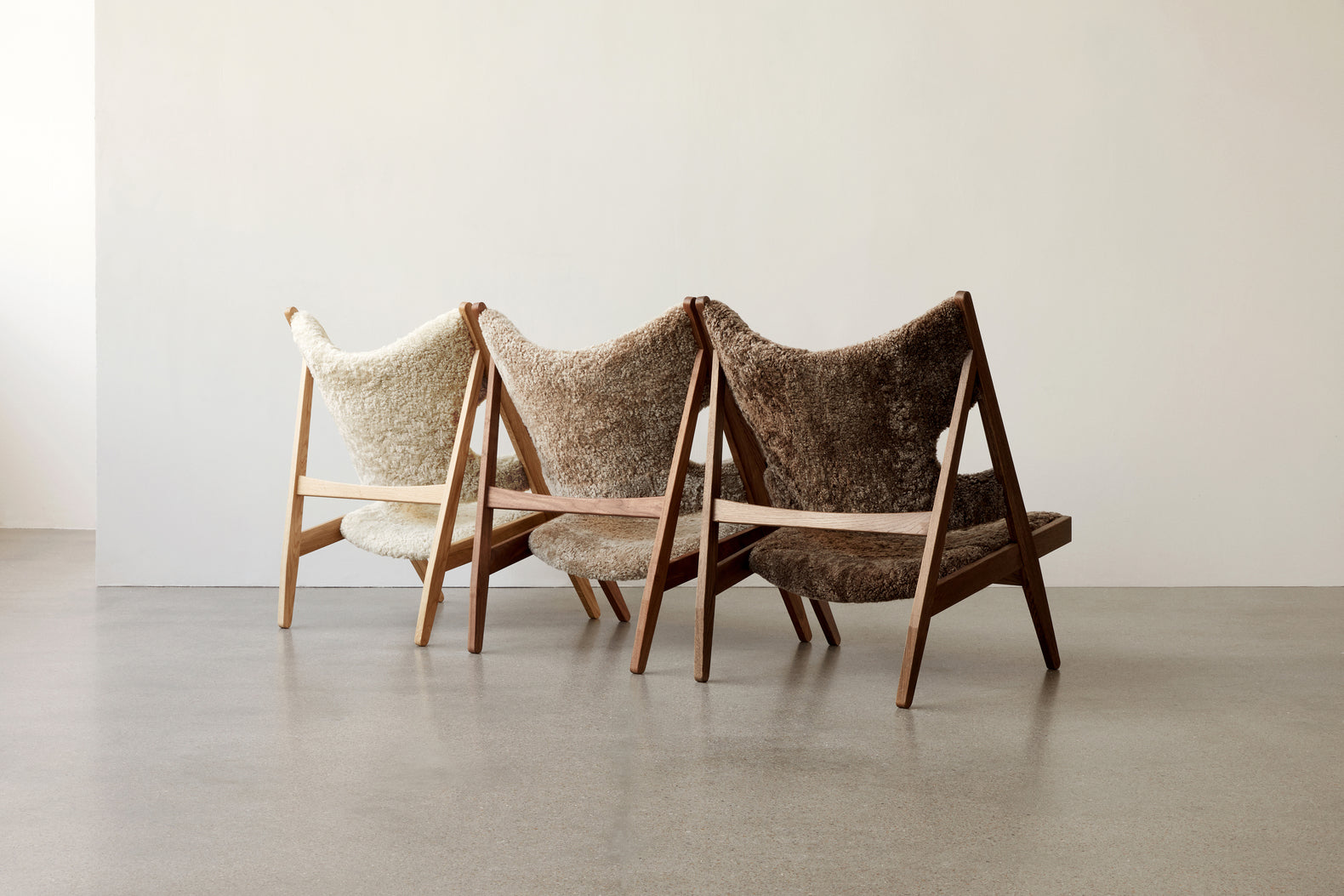 KNITTING armchair dark brown sheep leather with dark oak base