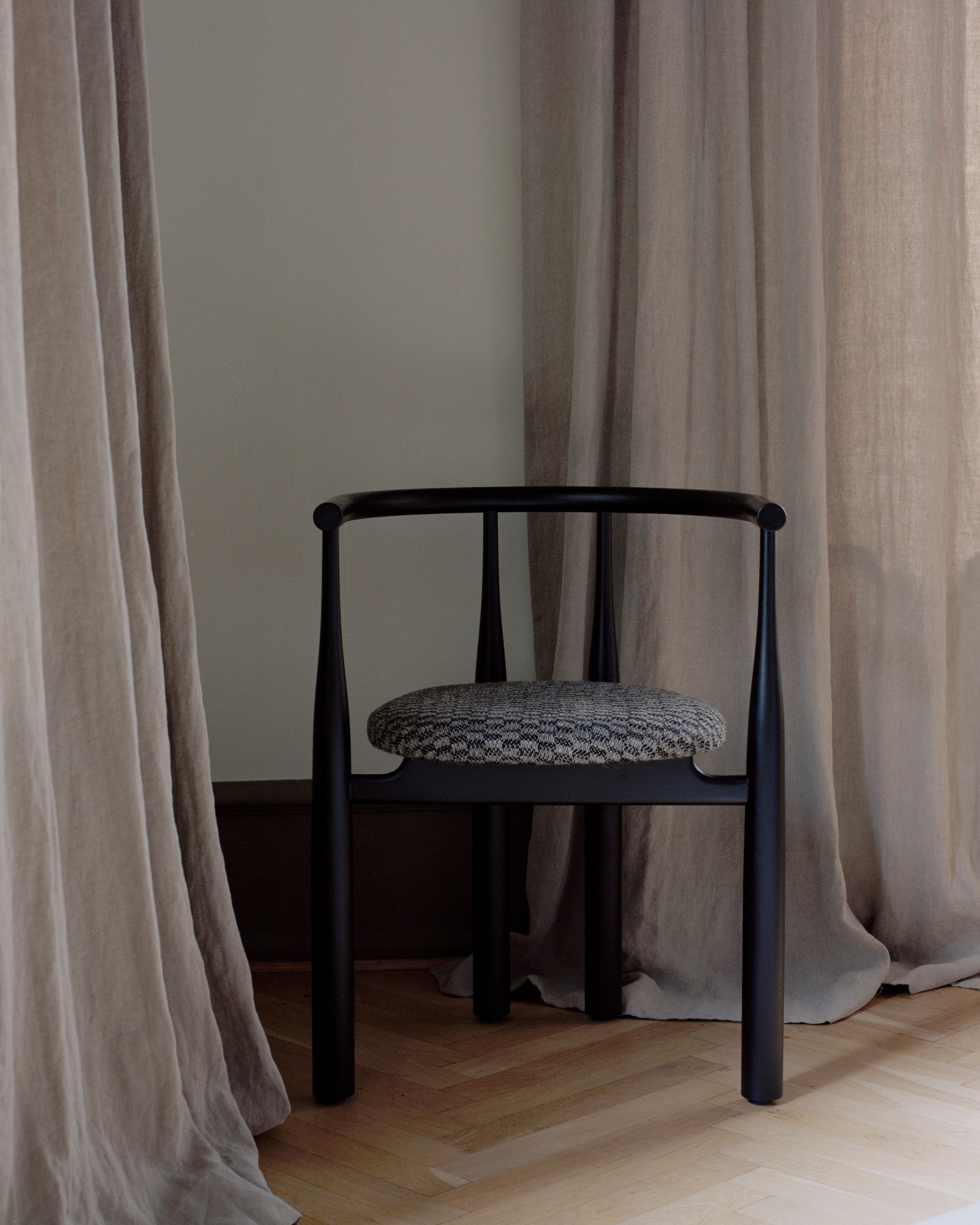 Bukowski chair upholstered with a black beech base