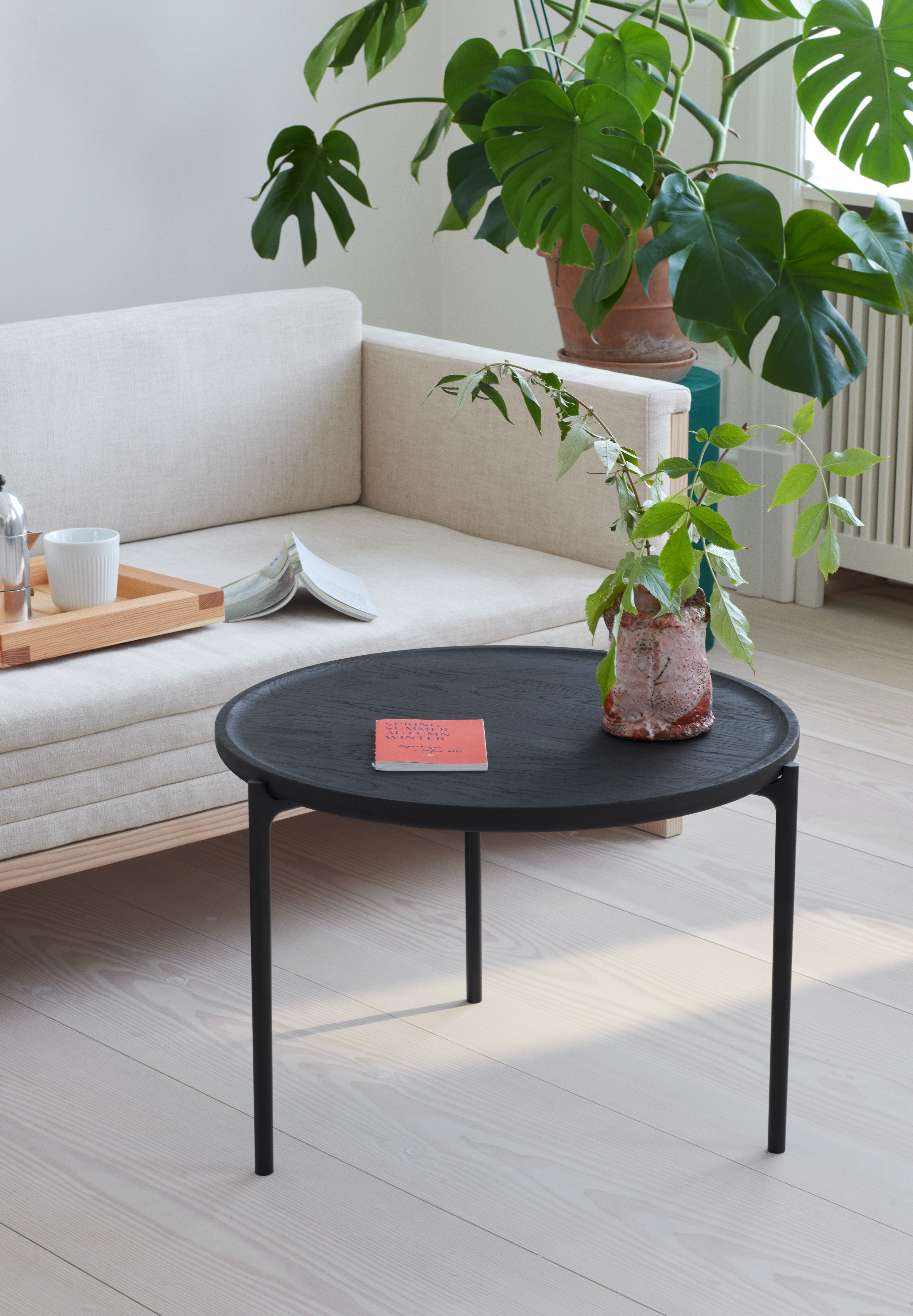 Round coffee table SAVOYE beige ceramic with black base