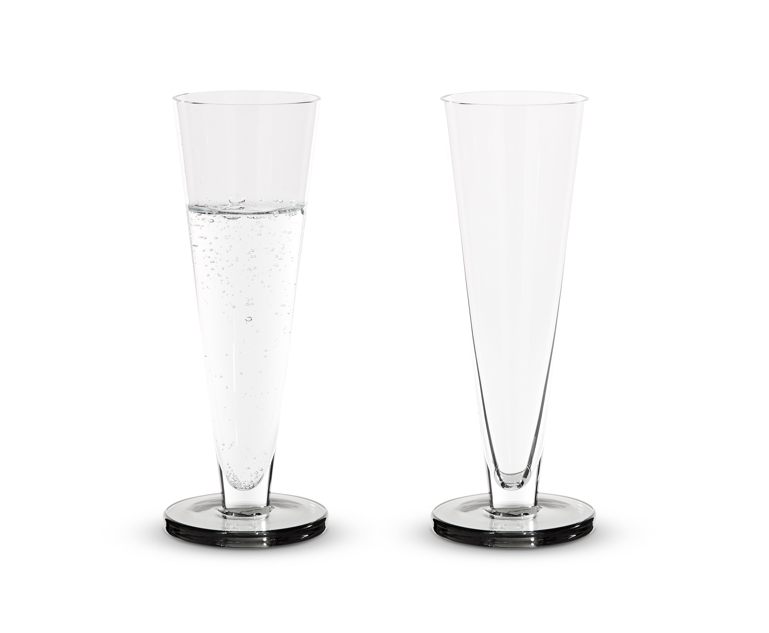 A set of Puck Flute glass champagne glasses