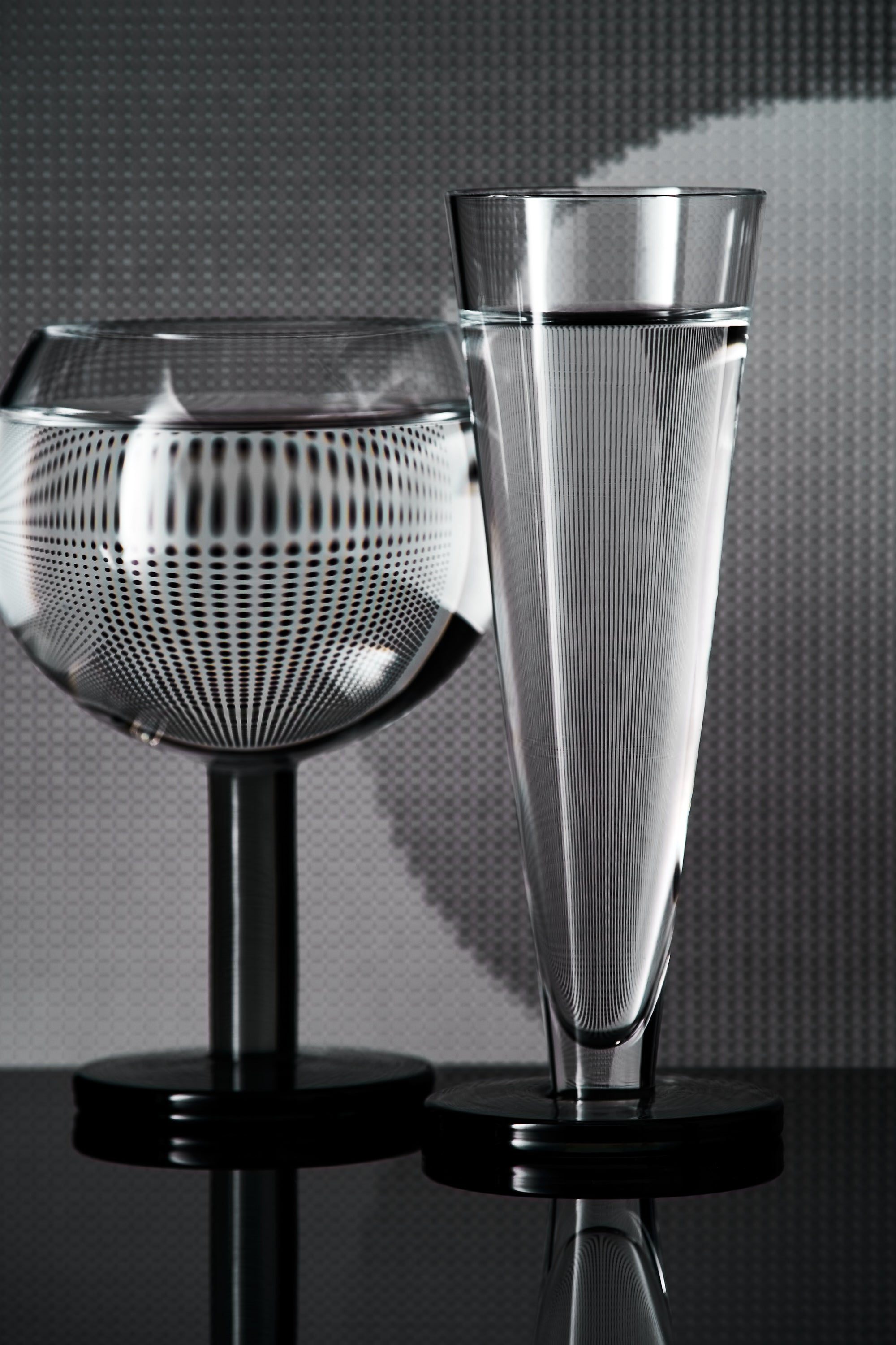 A set of Puck Flute glass champagne glasses