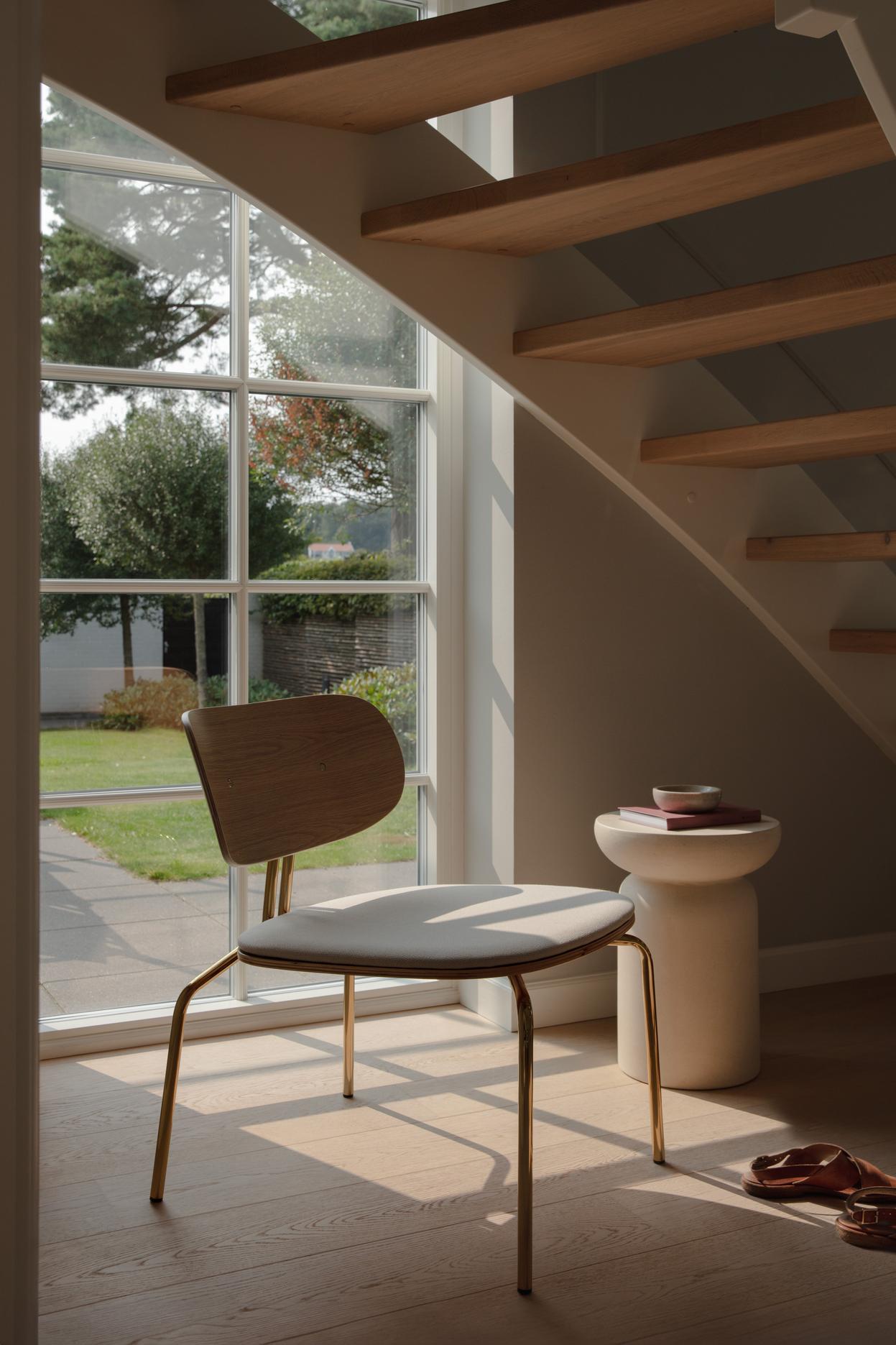 Curious oak veneer armchair with a golden base