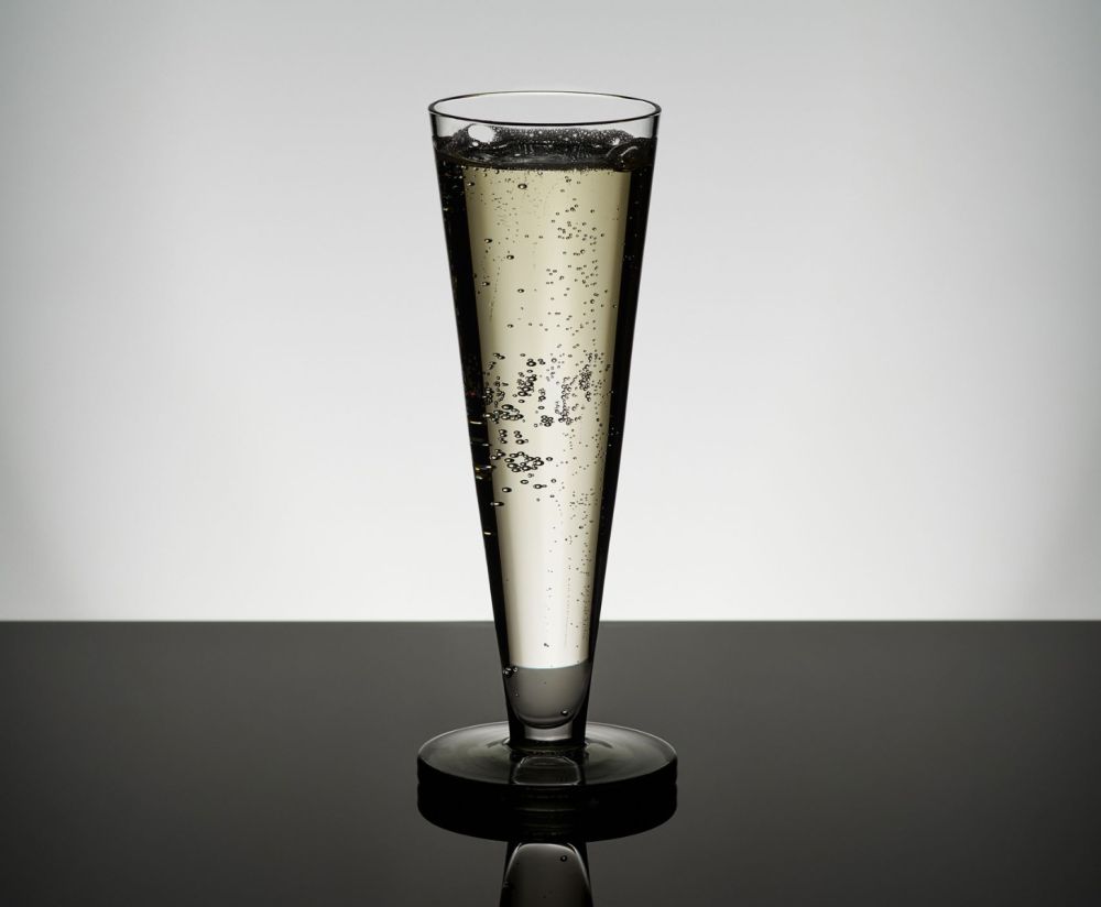 A set of Puck Flute glass champagne glasses