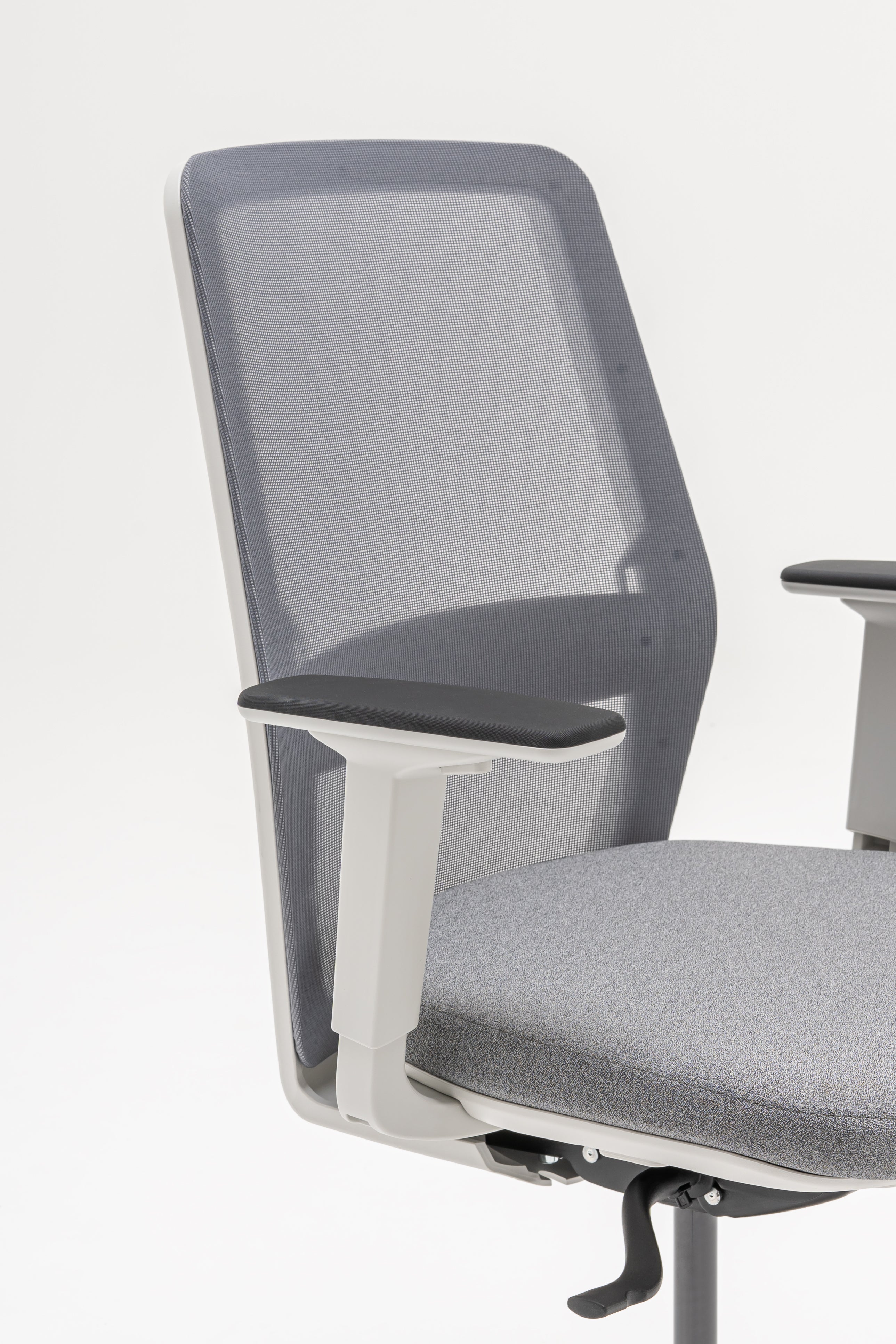 Armchair with an openwork EVO backrest adjustable base with wheels to the soft surface