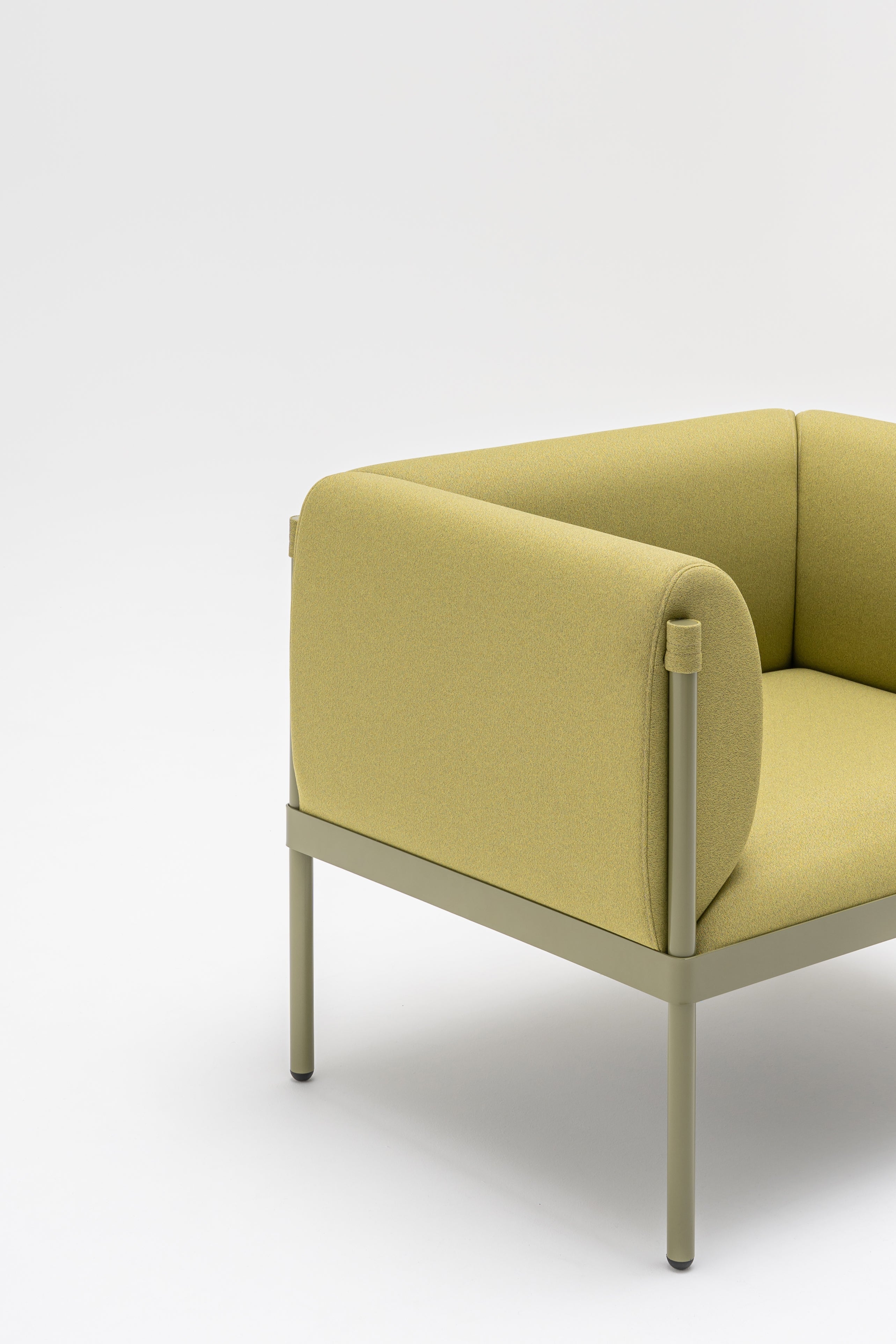 Low upholstered stilt armchair