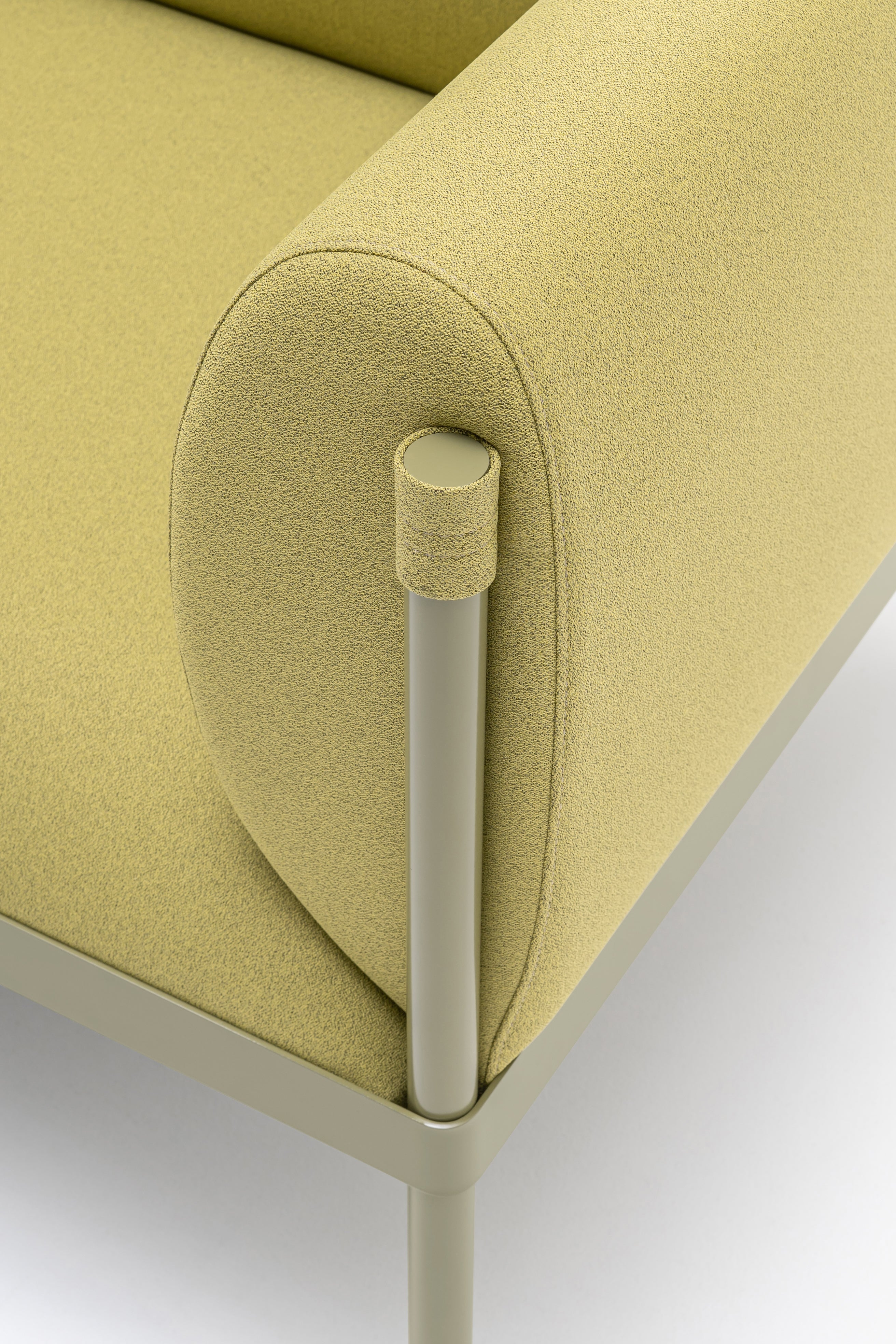 Low upholstered stilt armchair