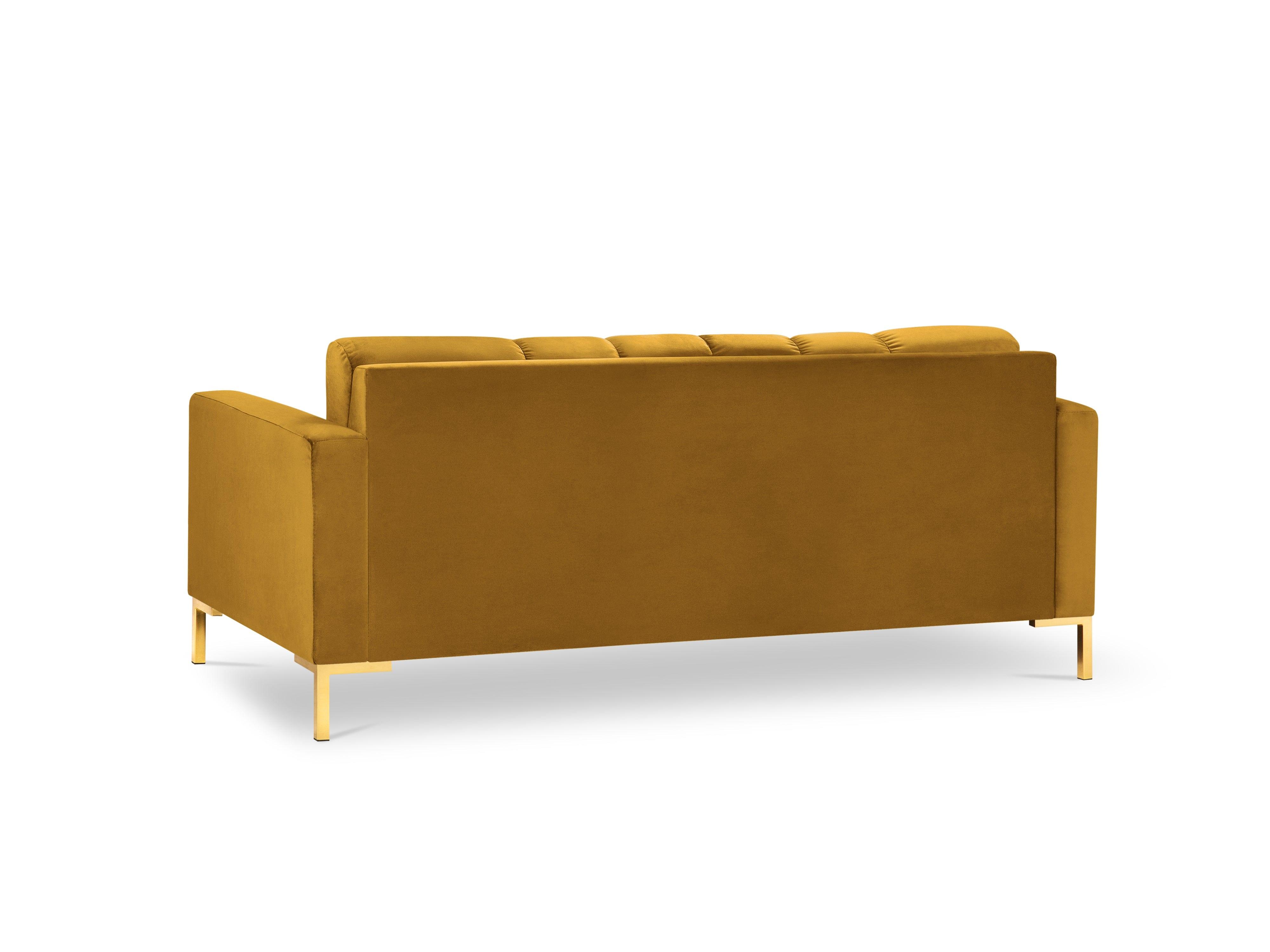 żółta sofa ze złotą podstawą 