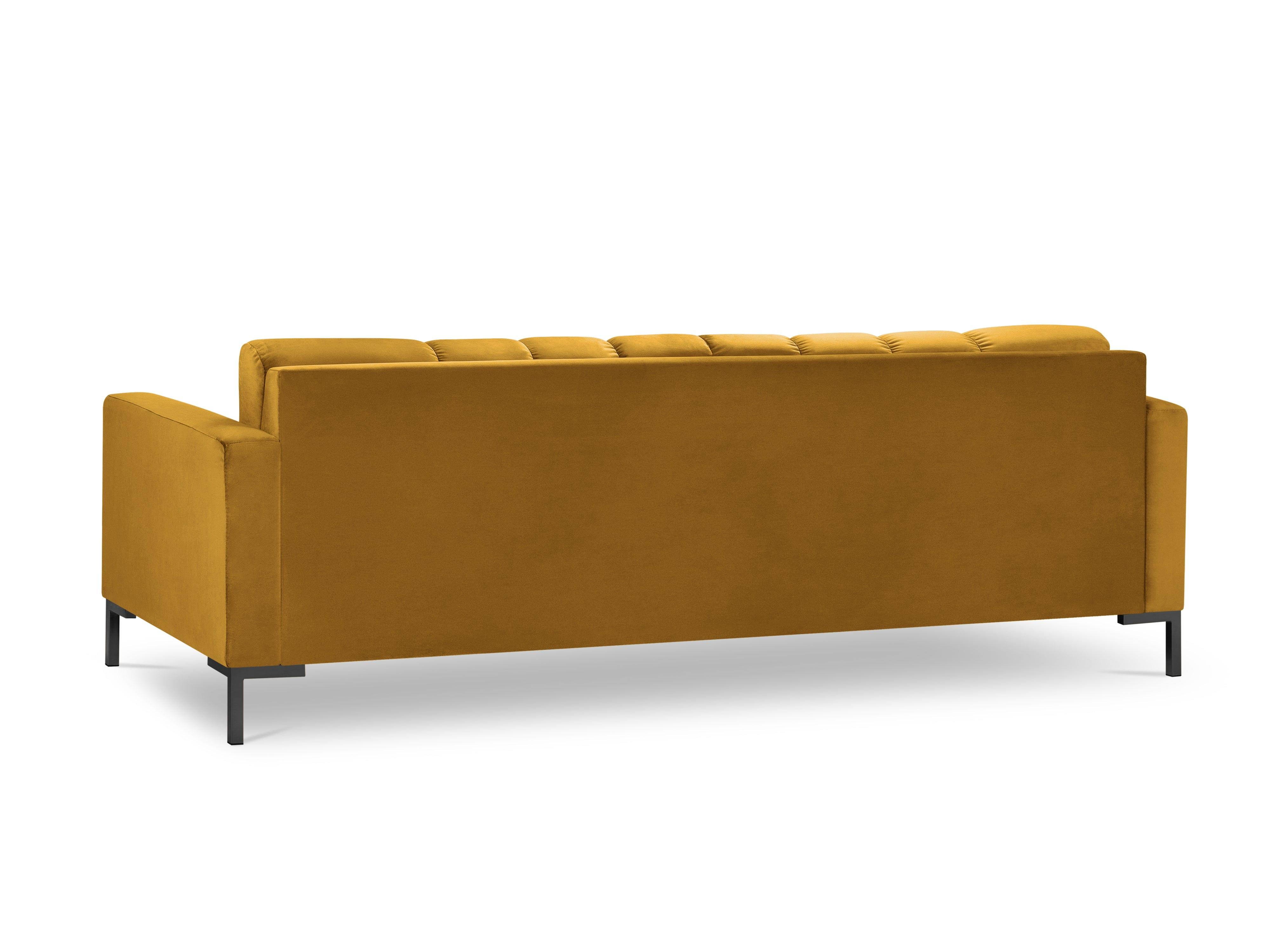 żółta sofa z czarną podstawą 